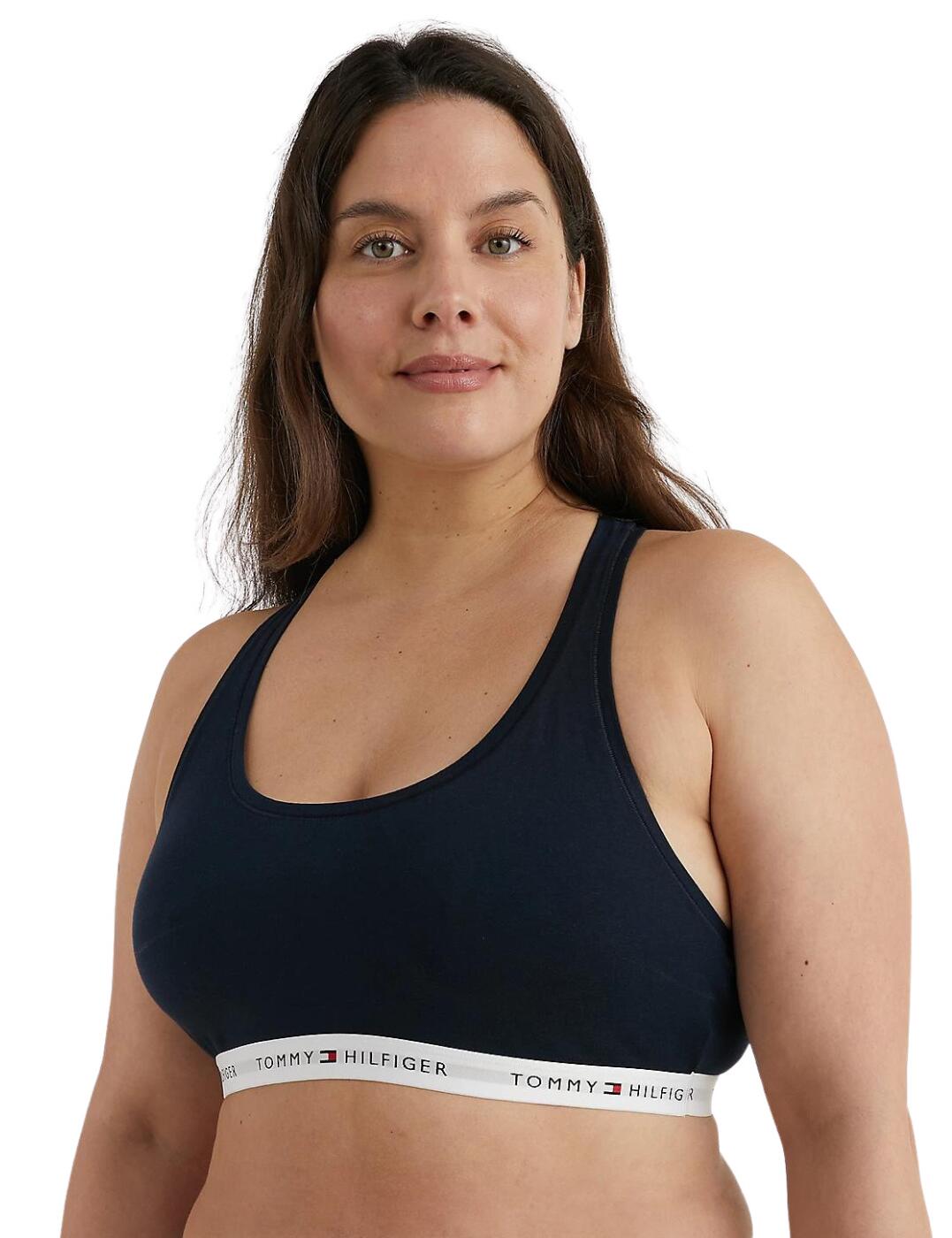 This bralette from Tommy Hilfiger's Icon 2.0 range is an essential addition to your underwear drawer, made from a super soft fabric that feels luxurious on your skin and gives a snug fit. The elastic underband features Tommy Hilfiger branding for a designer touch. Wide, fixed straps give a supportive fit and the pull-on design ensures it stays secure all day long. The cups are non-wired and non-padded for a comfortable, natural look.  Non-wired Non-padded Soft cotton modal blend Tommy Hilfiger branded underband Wide, fixed straps Pull-on design Country of origin: Sri Lanka Composition: 53% Organic Cotton &pipe; 35% Modal &pipe; 12% Elastane Listed in UK sizes  58283-102623-1357459 UW0UW04002  Bralette