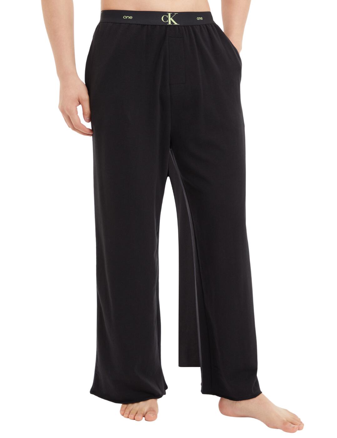 From the CK One Cotton collection, these pyjama pants look really stylish yet still comfortable. The elasticated waistband flaunts the signature CK One branding. Full-length leg and high-waisted for comfort. Two pockets on the front are great for holding a couple of things to help you out when you've got your hands full. The perfect straight leg design isn't constricting yet still flattering to your figure.  CK One logo on waistband Two pockets Matching coordinates available High-waist design Full-length straight leg Combination: 57% Cotton &pipe; 38% Polyester &pipe; 5% Elastane Country of origin: Sri Lanka Listed in UK sizes  56995-100830-1307567 000QS6888E  Pyjama Pants