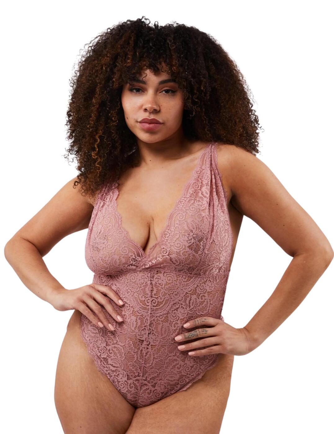 Wolf & Whistle's Ariana bodysuit is playful and fun, with all-over lace giving a feminine look. The cups are non-wired and non-padded for a natural feel and are cut to a plunging neckline. This piece boasts an elasticated underband to offer some support to your bust. Adjustable straps ensure you can get the perfect fit and the pull-on design is easy to put on and off. The thong-style bottom and high-cut legs give minimal rear coverage, flawlessly embracing your curves and showing off your hips.  Non-wired Non-padded Adjustable straps Pull-on design Elasticated underband All-over lace Plunge neckline Cotton gusset Thong style bottom High-cut legs Minimal rear coverage Country of origin: China Composition: 89% Polyamide &pipe; 11% Elastane Listed in UK sizes  58871-103403-1358779 WWL821AR Bodysuit