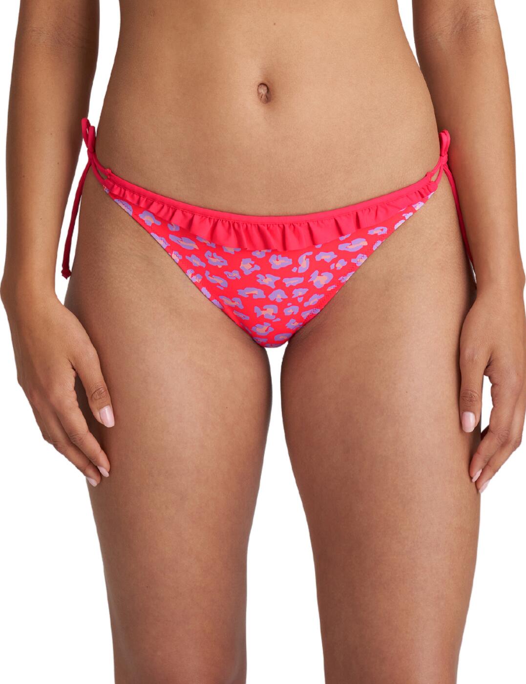 A playful and flattering tie side bikini brief, brought to you from the La Gomera collection by Marie Jo. The low waisted brief wraps around your hips for a comfortable and complimentary style. The ruffle trim around the top of the brief adds a delicate and feminine feature that stunningly contrasts against the vibrant pattern of the piece. The low cut legs create a triangular shaped brief which allows for moderate rear coverage.  Low waisted Tie sides Adjustable Ruffle trim Vibrant print Low cut legs Moderate rear coverage Country of origin: Tunisia Composition: 79% Polyamide &pipe; 16% Elastane &pipe; 5% Polyester Listed in UK sizes  58924-103482-1352553 1005854 Bikini Bottoms