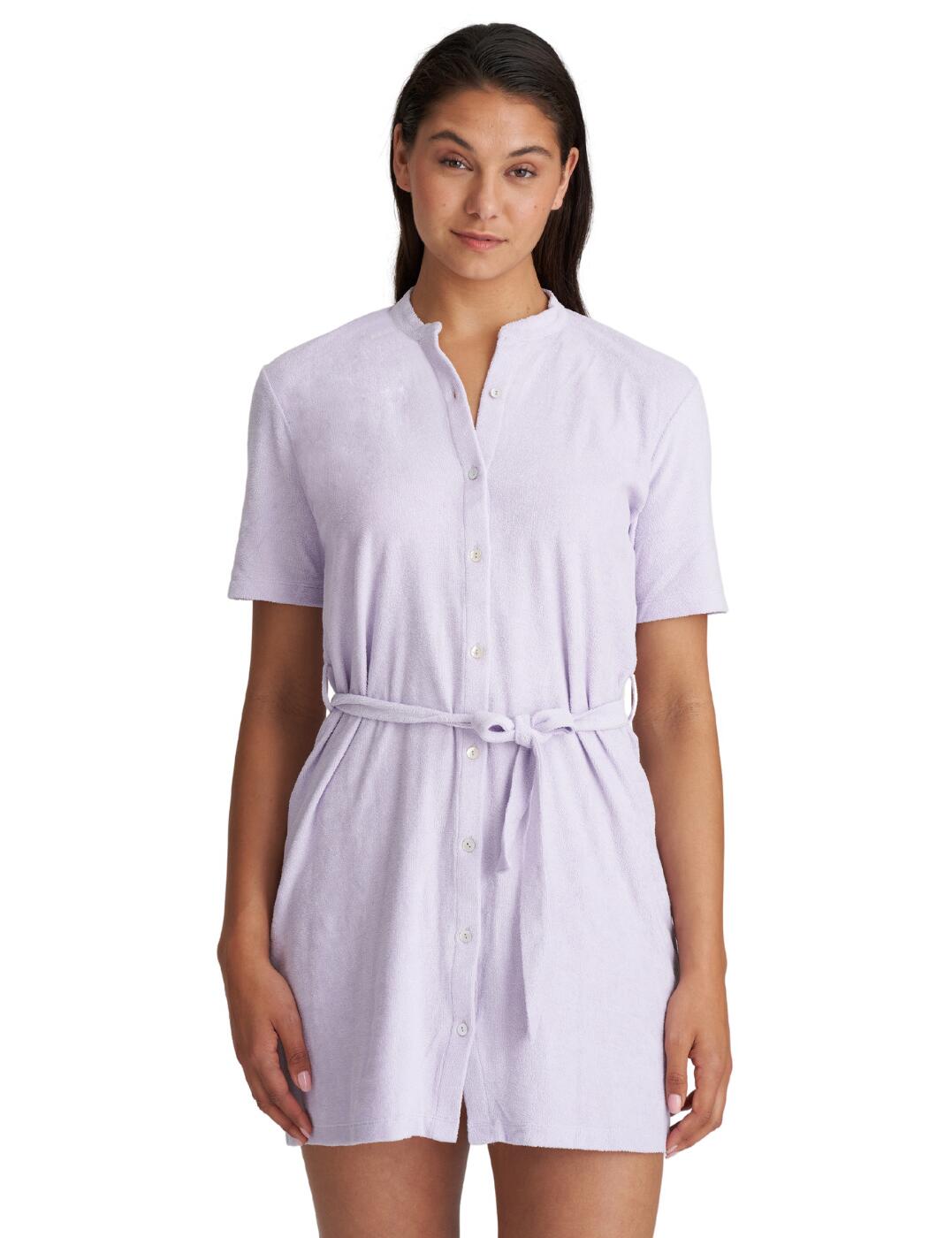Feel utter comfort in this short swimwear dress from the La Gomera collection by Marie Jo. The dress is made from towelling material meaning it is perfect for quickly dry after a dip, but also for that luxuriously soft feeling against the skin. It has short sleeves and a belt tie to cinch the waist which creates a feminine and modest style. It has buttons all down the front for easy dressing. It finishes along the thighs for a sweet yet slightly sultry look, for fashionable off the beach wear.  Towelling material Soft against the skin Short sleeves Belt tie to cinch at the waist Feminine yet modest style Button down Thigh high cut Country of origin: Turkey Composition: 100% Cotton Listed in UK sizes  58925-103483-1352559 1005880 Short Dress