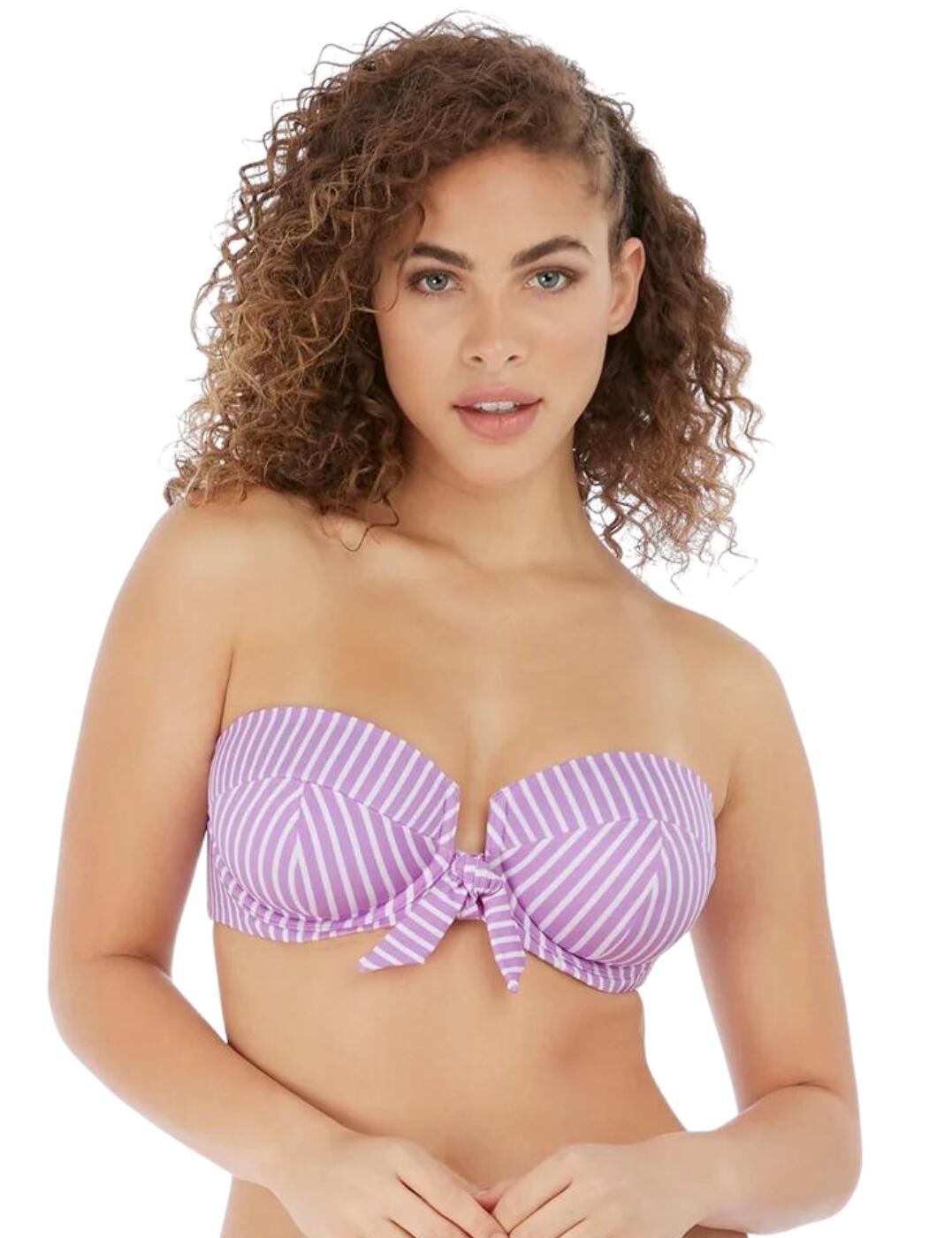 Freya's Beach Hut bandeau bikini top is versatile and chic, with adjustable straps that can be converted from straight to cross-over, or removed for the perfect look no matter what you are doing. The cups are underwired for support and lightly padded, giving your bust a smooth, round shape. The rear clip fastening will stay secure all-day long for worry-free wear. The chic knot detail and open-centre front design add a feminine, flirty touch.  Underwired Lightly padded Adjustable straps Clip fastening Front knot detail Open-centre front Removable, convertible straps Country of origin: Sri Lanka Composition: 69% Polyamide &pipe; 16% Elastane &pipe; 15% Polyester Listed in UK sizes  58940-103500-1360424 6791 Bandeau Bikini Top