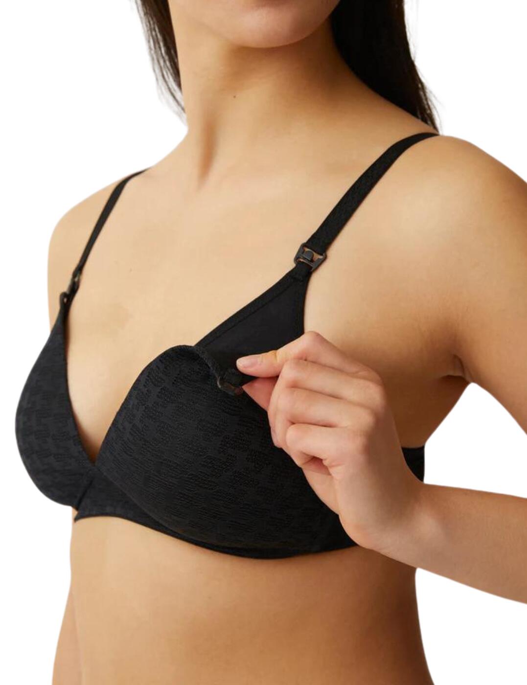 When comfort is most important this nursing bra, from the Everyday collection by Naturana, delivers. The soft cups offer a smooth touch against the skin, combined with no underwiring for a comfortable fit. The shell of the cups is skin friendly and absorbent. There is a further internal chest support made from cotton to further extend your comfort. A clip closure is added to the cups for easy closure. Fully adjustable straps allow for a personalised fit. A hook and eye closure at the rear makes sure of an easy wearing style.  Soft cups No underwiring Non-padded Absorbent Skin friendly Internal chest support made from cotton Clip closure on cups Fully adjustable straps Hook and eye closure Country of origin: China Composition: Front part: 82% Polyamide &pipe; 18% Elastane Composition: Insert: 100% Cotton Composition: Back part: 90% Polyamide &pipe; 10% Elastane Composition: Cup lining: 100% Polyester Listed in UK sizes  59105-103727-1355291 5565 Maternity Bra