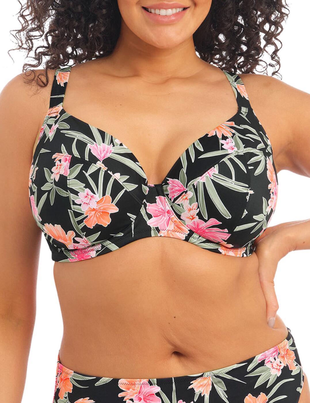 Turn heads and look breezily beautiful in the Elomi Dark Tropics Plunge Bikini Top. Perfect for injecting a touch of vibrant glamour into beachwear, this delightful plunge-style bikini top features an enlarged botanical print in a striking colour combination. As well as creating a high degree of style, Elomi has made sure that this bikini top certainly fits the bill when it comes to comfort and practicality too. Featuring underwired support, non-padded cups, lightly-lined interior, wide adjustable straps, and a traditional plastic clasp to secure at the rear. Specially developed for fuller figures, this charming piece is essential.  Enlarged, botanical print with striking colour contrast Popular plunge design for flattering cleavage Underwired support Non-padded cups Lightly lined for comfort Wide, fully adjustable straps Ideal for the fuller figure Secures at the rear with a traditional plastic clasp Country of origin: Indonesia Composition: 84% Polyamide &pipe; 16% Elastane Listed in UK sizes  59142-103796-1361546 800102 Plunge Bikini Top