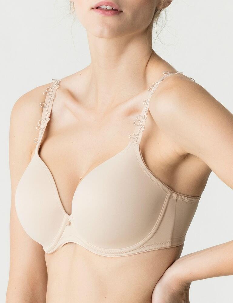 If you're wanting to add some luxury to your lingerie drawer, then look no further than the Perle range by Prima Donna. This deep plunge padded bra is perfect for anyone wanting a good everyday bra which will enhance their bust and cleavage. The classic design is given a feminine touch thanks to the gorgeous fine guipure pattern on the shoulder straps. The cups are underwired and padded to create a fuller, lifted bust. The deep plunge neckline accentuates the cleavage, which is further enhanced thanks to the padded cups. The straps are adjustable so that you can find your unique fit and the bra secures with a hook and eye closure at the rear. Pair with matching items from the Perle range for a chic look.  Gracious and chic, feminine design Offers excellent shape and support! Deep plunge style draws attention to the cleavage Underwired support & uplift Secures at the rear with hook and eye closure Padded for a great shape Adjustable straps Matching co-ordinates available! Composition: 36% Polyurethane &pipe; 32% Polyester &pipe; 24% Polyamide &pipe; 8% Elastane Listed in UK sizes  44195-81510-1098714 0162344/0162345 Padded Bra