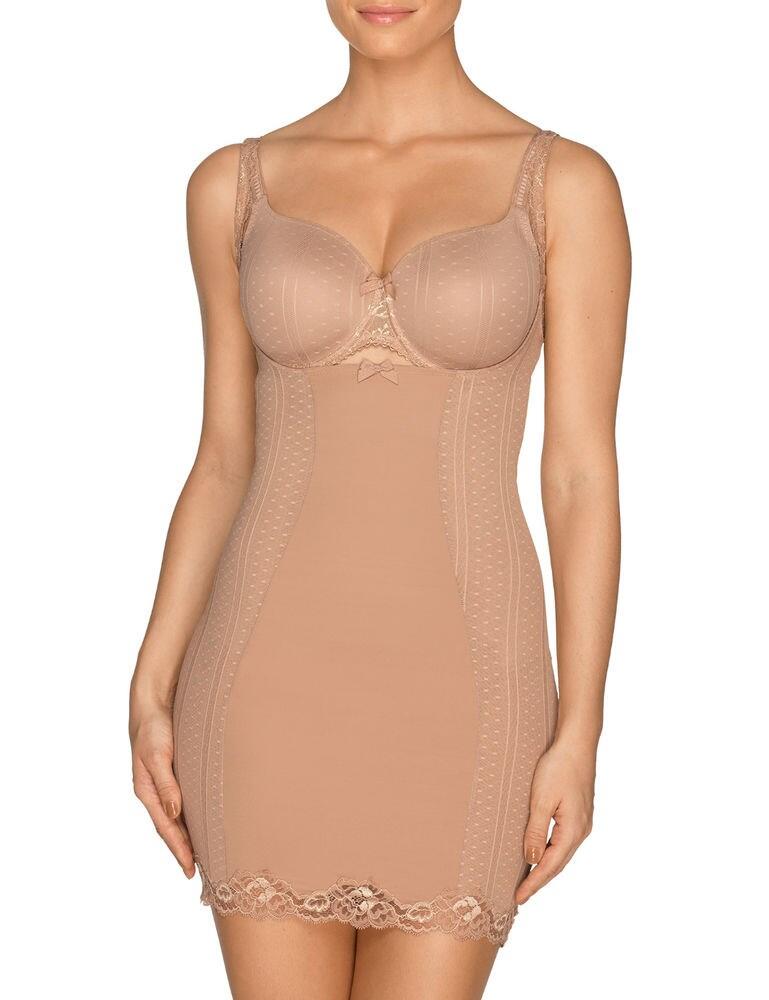 Create a gorgeous silhouette thanks to this wear your own bra shaping dress from the Couture range by Prima Donna. This stunning shaping dress helps shape the body, creating a smoother silhouette. This shaping dress fits around the bra, so you can wear whichever bra of your choosing. The gorgeous lace trims also add a feminine flair to this shaping dress. Streamline the body with this gorgeous shaping dress, and pair with matching items from the Couture range for a pretty look which will perfect your silhouette.  Feminine, elegant design Comfortable fit Pretty lace trim Fits around your bra Adjustable straps for an individual fit Matching coordinates available Composition: 72% Polyamide &pipe; 27% Elastane &pipe; 1% Cotton Listed in UK sizes  44218-81608-1185662 0862580 Shaping Dress