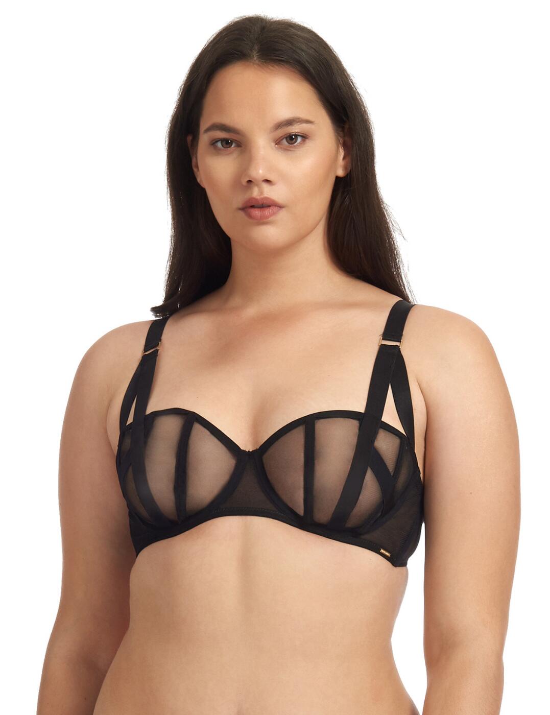 If you are wanting to spice up your bedroom play this Karolina bra is not one to miss out on. From Bluebella, it is crafted from good quality materials giving a luxurious feel with super soft fabrics that ensure a comfortable fit whilst looking incredible. This bra has balcony-shaped cups that are non-padded but provide a supportive fit from the underwire. It gives a cage effect with all-over dark sheer mesh with cross-over straps that draws attention to your gorgeous bust. The bra has a double playful strap feature at the front that join as one at the shoulder and are also adjustable to allow for a unique fit as well as the hook and eye closure at the rear. Matching items are also available to create a fully coordinated look.  Balcony-shaped underwired bra Non-padded cups Sheer dark mesh with cross straps creates a cage-type effect Playful double straps that are adjustable Hook and eye closure Gold hardware Matching items are also available Country of origin: China Composition: 96% Polyester &pipe; 4% Elastane &pipe; Excluding trims  Listed in UK sizes  40149-BK-32B 40149  Balcony Bra