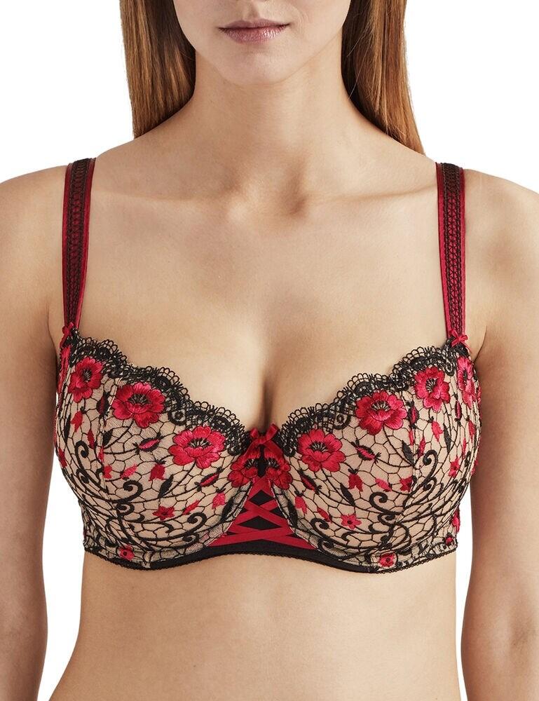 Give your bust a great look and feel in this half-cup bra from the Fièvre Andalouse range at Aubade. The push-up effect that the cups offer will accentuate your bust for a great silhouette and shape. This bra has been designed for a fuller bust size, with great support in mind. The cups have bright floral embroidery and a satin bow for a stunning look with scalloped top cup edges. The front centre features a criss-cross satin effect for added detail.  Half-cup with push-up effect for fuller busts Bold floral embroidery Scalloped edges Satin bows detailing Hook and eye closure Adjustable straps Composition: 83% Polyamide &pipe; 17% Elastane Listed in UK sizes  48053-87480-1165504 QC14-02  Half Cup Bra