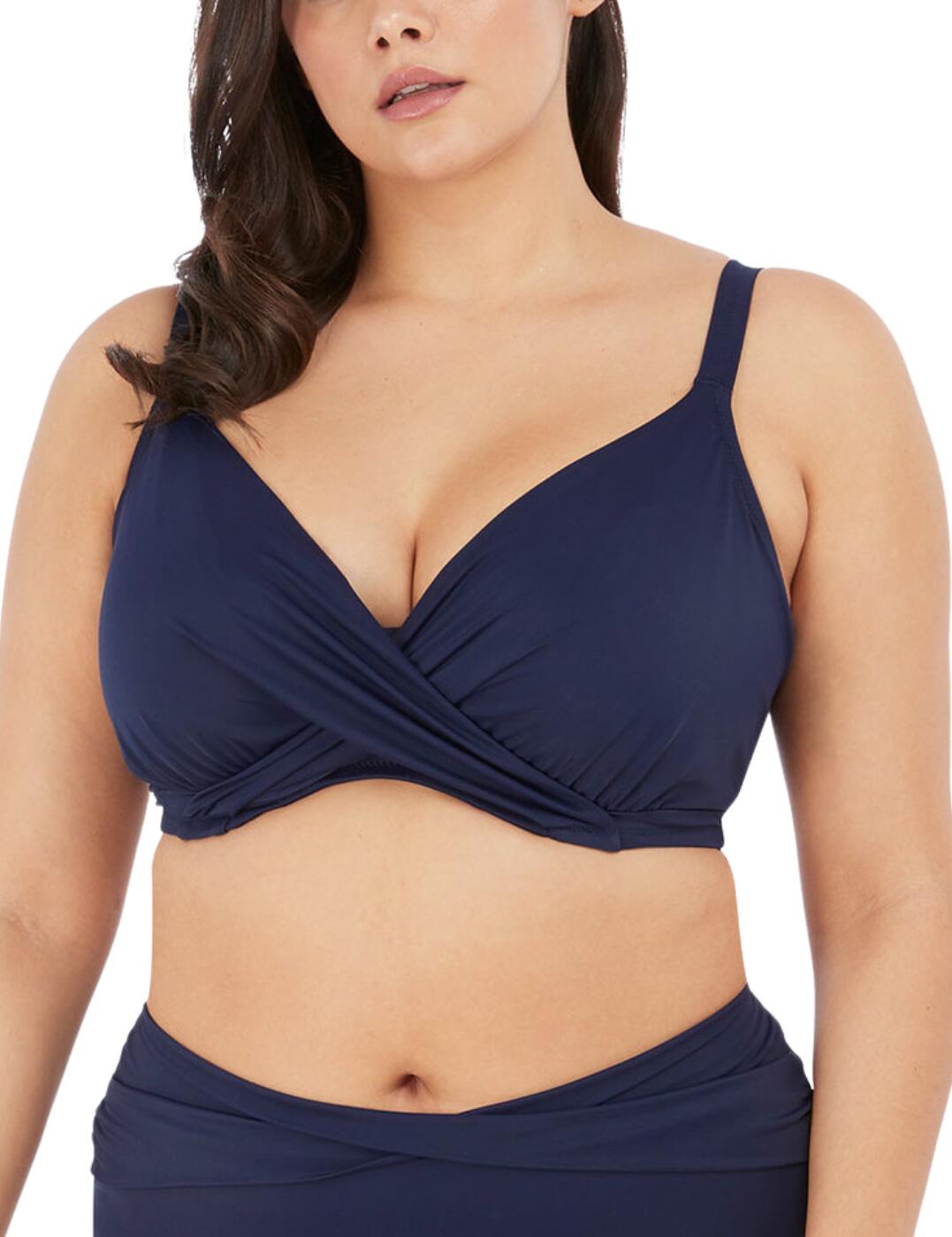 Elomi brings your elevated classic with the gorgeous Magnetic collection. Perfect poolside elegance is yours with this plunge bikini top. This piece features a gorgeous wrap overlay detailing on the bust to flatter your beautiful curves and add a chic flair. The cups are fully lined and boast underwiring to achieve that classic Elomi support and lift that we know and love, with the Powernet back lining adding that extra support you want. Fastened at the rear with a traditional clasp closure and the straps are fully adjustable for a fit you can tailor to your own individual preference. A hidden elastic is featured in the plunging neckline for ease of fit.  Wrap overlay detailing Hidden elastic on the neckline Adjustable shoulder straps Fully lined cups Underwired Back clasp closure Powernet back lining for additional support Same fit as an Elomi bra! Country of origin: Sri Lanka Composition: 84% Polyamide &pipe; 15% Elastane Listed in UK sizes  59265-103925 7193  Plunge Bikini Top