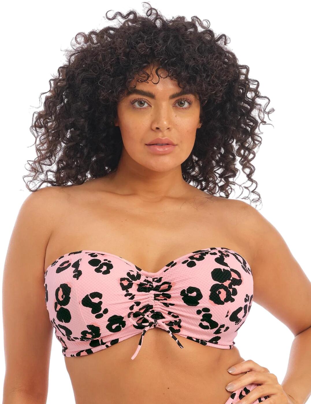 Treat yourself to a new and exciting swimwear option with the Kambuku collection from Elomi. This bikini top is just what you need to make you stand out with the wild leopard print and bright colours. The lightly padded cups have a hidden underwire so that your bust is supported and shaped to perfection. The gathered tie detail in the centre gives additional interesting flair. The adjustable shoulder straps are detachable and can be worn in a multitude of ways - over the shoulder, cross back or strapless - giving you a brand new look every day within the same bikini top.  Leopard print Soft fabric with honeycomb texture Silicone-coated elastic at the back Gathered tie on the centre front Lightly padded Underwired Detachable and adjustable multiway shoulder straps Traditional swimwear clip fastening Country of origin: Indonesia Composition: 72% Polyamide &pipe; 13% Elastane &pipe; 15% Polyester Listed in UK sizes  59274-103940-1360762 ES800210 Balcony Bikini Top