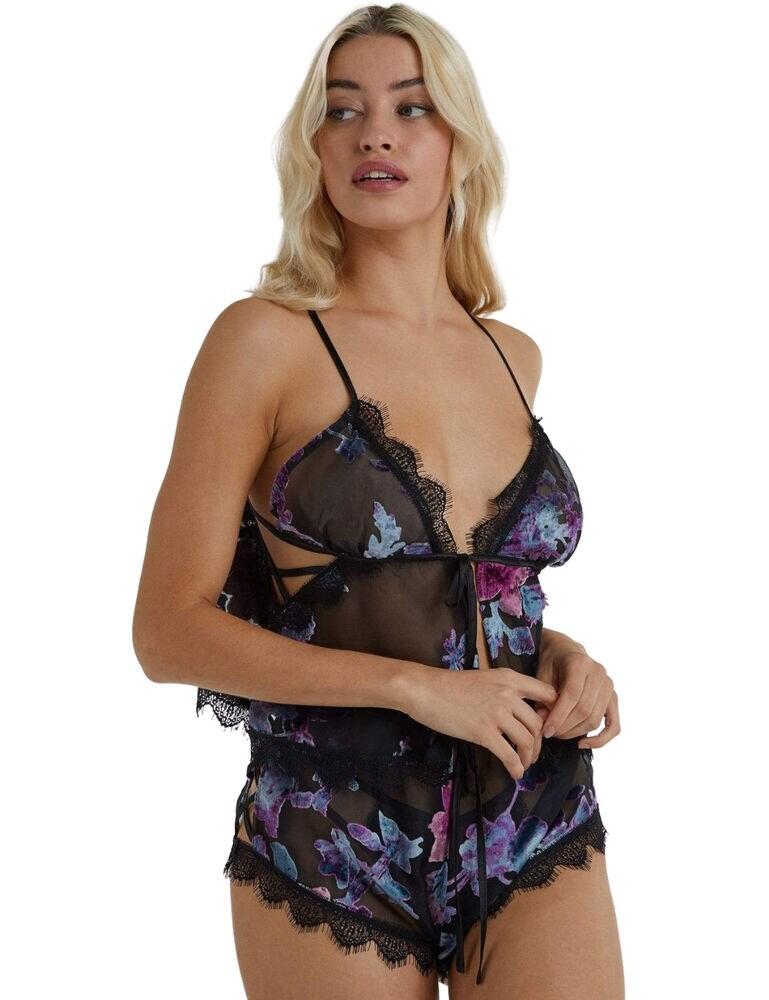 Add some sensuality to your nightwear collection with this stunning two-piece cami and short set from the Frankie Devore collection at Wolf and Whistle. Completely designed in a sheer floral Devore with seductive cut-outs and a front tie, let this set add a peek-a-boo effect to your skin. The edges are trimmed with a lace frill for added detail, with criss-cross details at the sides. They are loose-fitting so feel ultra-comfortable when sleeping.  Two-piece set - cami top and shorts Sheer floral Devore Cut-outs with a criss-cross at sides Front tie closure on the cami Frill lace trims Loose-fitting Composition: mixed fabric content Listed in UK sizes  48080-87508-1158792 WWL8178 Cami and short set