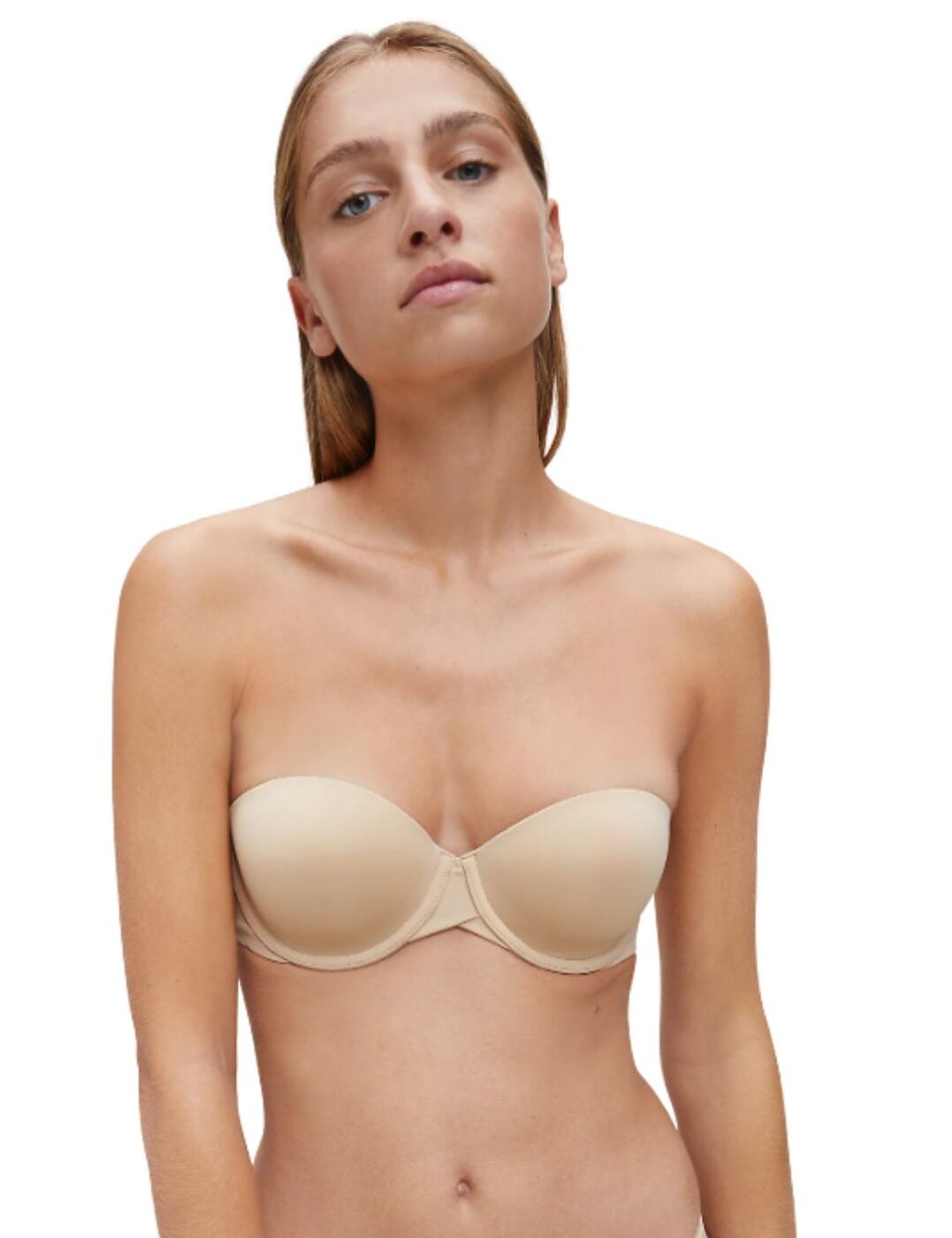 This bra will be your best friend under any clothing being part of the Invisibles range at Calvin Klein. It offers minimal detailing on a super-soft fabric for a classic and simple design. The cups are lined with no padding for a natural shape, but still give full support with underwiring, a wide clasp fastening and optional straps. The clasp fastening is at the side of this bra, to give the back a smooth appearance under clothing.  Classic and invisible design Minimal detailing Lined, non-padded cups Underwired Wide clasp fastening at side Detachable straps Composition: 80% Polyamide &pipe; 20% Elastane Listed in UK sizes  48418-87976-1164377 QF5748E Strapless Bra