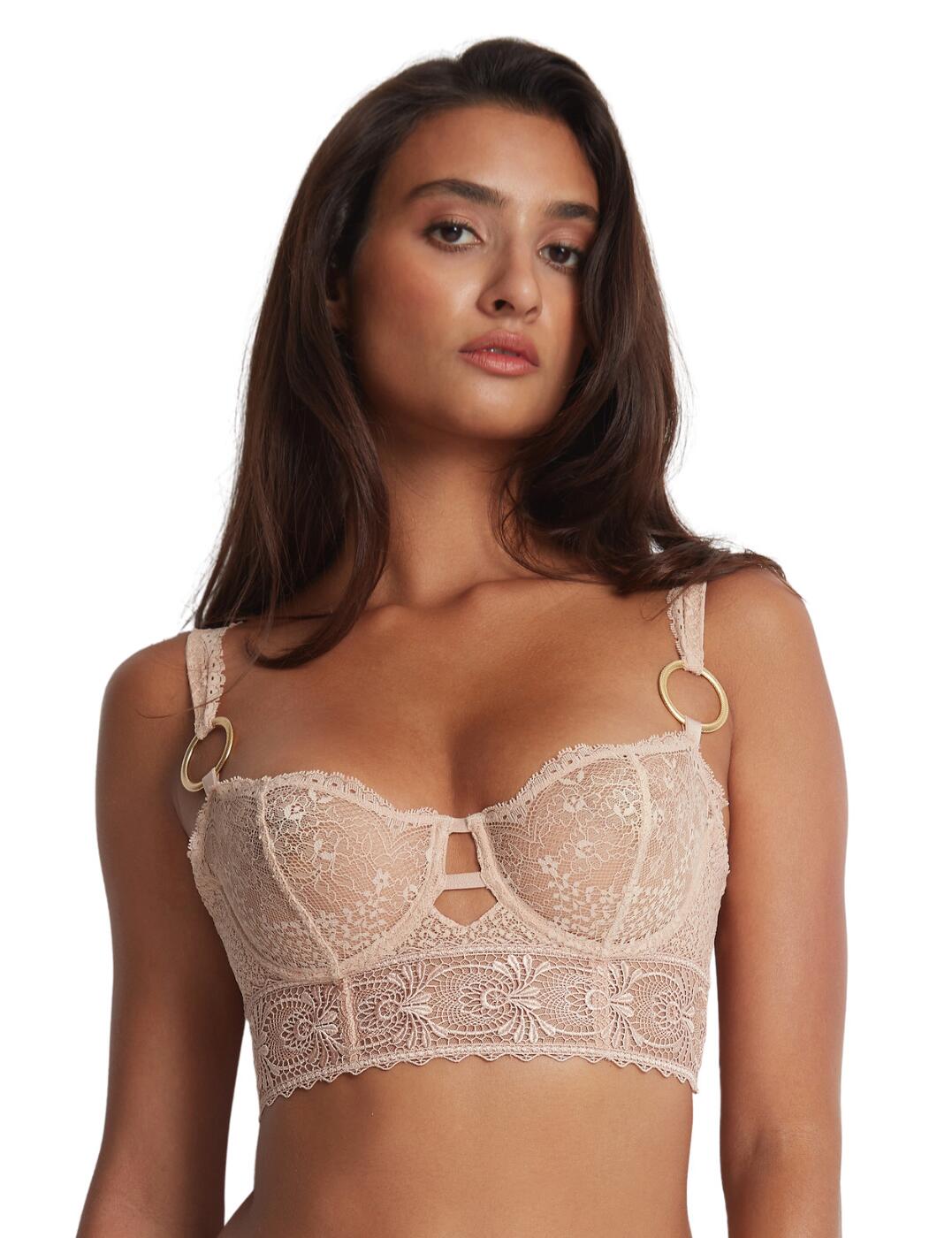 Aubade introduces the Sensual Euphoria collection for a bold combination of romantic femininity of semi-sheer lace materials and a daring touch of bondage-reminiscent details. This bra features a flattering longline underband, which ends with a combination of seductive silky straps on the back, closing in a traditional hook and eye fastening. To offset the bold look of the back, the front is made out of feminine semi-sheer lace and guipure embroidery. The half-cup design beautifully displays your decolletage, while the underwired non-padded cups securely support your bust. On the bottom of each of the shoulder straps, there is a golden ring, which is perfectly complemented by golden hardware throughout the design.  Half-cup design Longline band Semi-sheer guipure lace material Keyhole opening in the centre Decorative golden hardware Strappy band on the back Non-padded Underwired Adjustable shoulder straps Hook and eye back closure Country of origin: Tunisia Composition front embroidery: 100% Polyester Composition cup lace: 100% Polyamide Composition lace: 88% Polyamide &pipe; 12% Elastane Composition front lace: 84% Polyamide &pipe; 16% Elastane Composition lining: 100% Polyester Listed in UK sizes  59491-104195-1363471 LEF14 Half Cup Bra