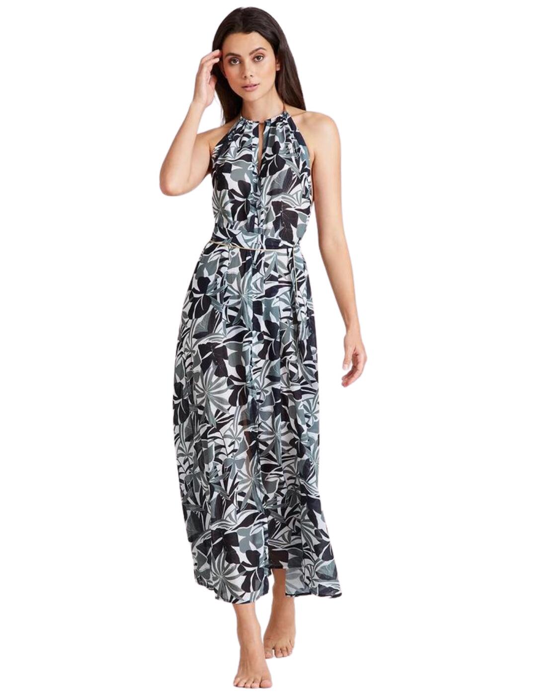 No beach look is complete without a beautiful cover-up and this elegant dress is a part of the Beach Paradise range by Aubade. In hot summery weather, flowy loose pieces are a must-have. The dress features an easy slip-on design with a halterneck tie straps, sexy bareback, a high front and a flattering tie waist which is removable. It also has a feminine slit at the front making it even more perfect for those hot beach days. This dress has an all-over fun print with gold detailing running throughout. Pair with any Aubade swimwear to create a luxurious and eye-catching beach look.  Dress Easy slip-on with halterneck tie straps Loose-fitting Bareback Tie waist which is removable Feminine centre slit All-over print with gold detailing Country of origin: China Composition: 100% Polyester Listed in UK sizes  56223-99853-1296013 IZ63  Beach Dress