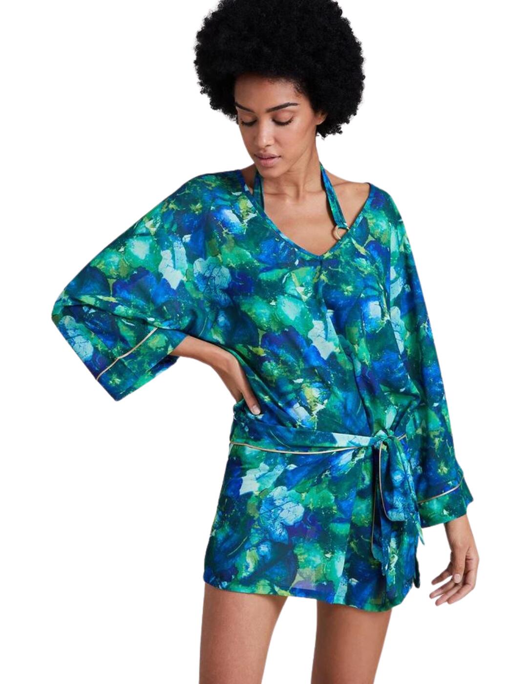 Relax in luxury with this new tunic from the Beach Paradise range by Aubade. This little beach cover-up dress features a super cute design with an all-over fun print, gold piping throughout, a v-shaped neckline, loose long sleeves and a tie belt that sits at the waist. It sits mid-thigh and has a mini slit in the side for an extra feminine touch. Finished off with a gold tab with the Aubade logo.  Tunic Beach cover-up All-over fun print with gold piping V-shaped neckline Long sleeves Tie belt waist which is removable Mid-thigh length Luxurious gold tab with Aubade logo Country of origin: China Composition: 100% Polyester Listed in UK sizes  56225-99855-1296015 IZ69  Beach Dress