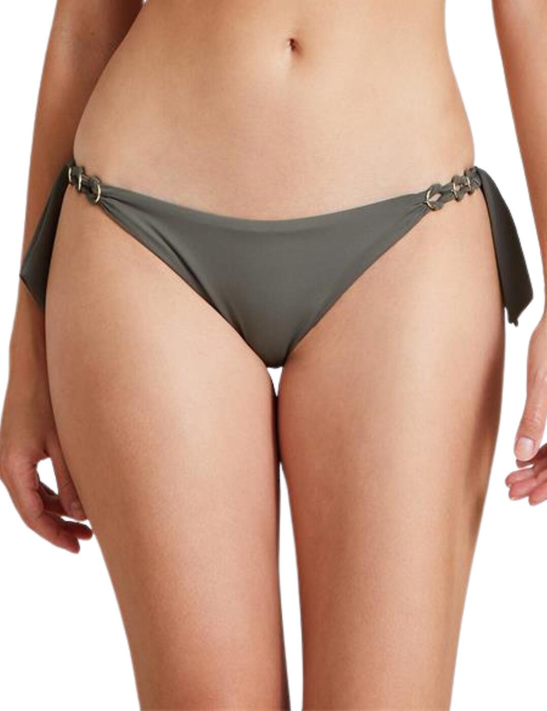 The Ocean Cruise range by Aubade is a new summer must-have with swimwear classic that features a sophisticated touch as well as being made out of recycled fabric that creates sustainable swimwear. This brazilian bikini brief will showcase your amazing silhouette with a low-rise waist and medium rear coverage. It is covered in a plain opaque fabric throughout with elegant gold zamak rings at each side along with the side tie detail which adds a luxurious touch to a classic.  Brazilian bikini brief Low-rise waist and medium rear coverage All over plain opaque design Elegant gold zamak rings at the side Side tie detail Country of origin: China Composition: Lining: 79% Polyester &pipe; 21% Elastane Composition 2: Knit: 83% Polyamide &pipe; 17% Elastane Listed in UK sizes  56258-99913-1295934 IR20  Bikini Brief