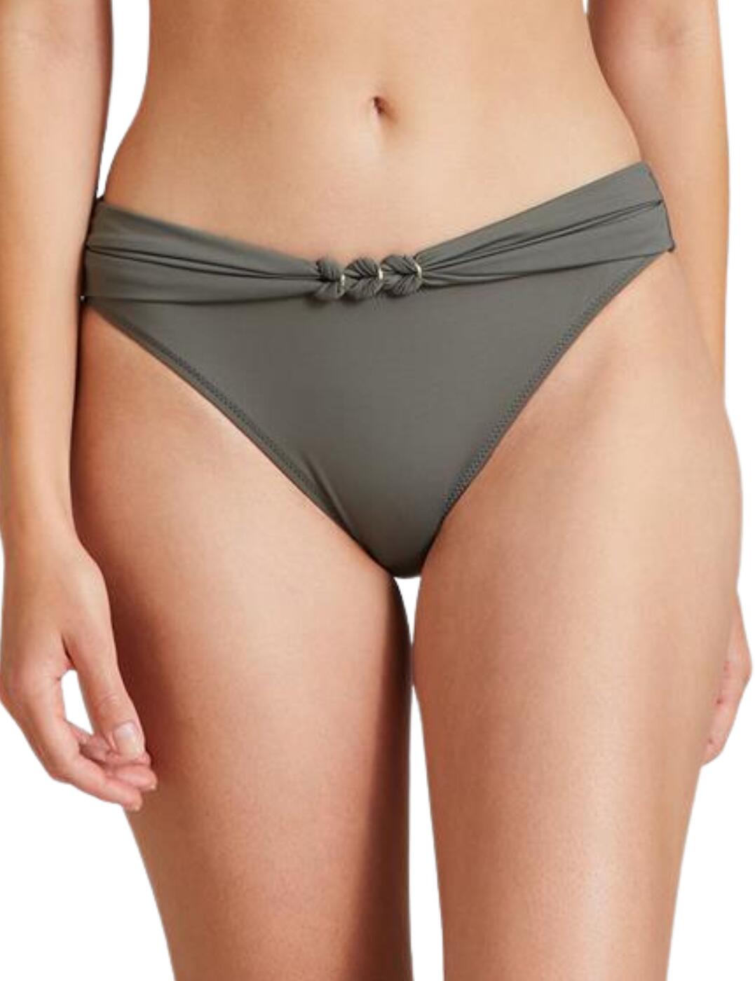 These brazilian bikini briefs are a part of the Ocean Cruise range by Aubade. The brief hosts a classic style with a plain opaque fabric throughout which is made from environmentally friendly fabric meaning it not only looks and feels incredible it is also caring for the environment. It has a low-rise waist and provides medium rear coverage. Made complete with a zamak gold rings at the centre which matches any of the Ocean Cruise bikini tops which are also available.  Brazilian bikini brief All over plain opaque fabric Low-rise waist Medium rear coverage Zamak gold rings at the centre Matching bikini tops Country of origin: China Composition: Lining: 79% Polyester &pipe; 21% Elastane Composition 2: Knit: 83% Polyamide &pipe; 17% Elastane Listed in UK sizes  56264-99920-1295960 IR22  Bikini Brief