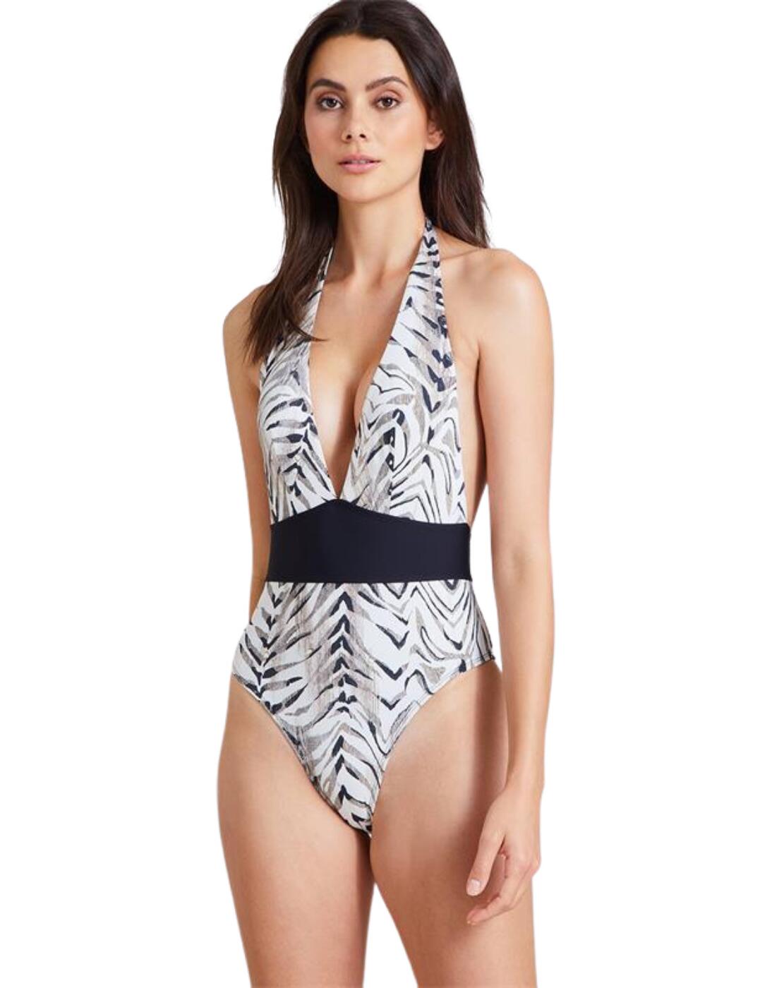 Add a touch of luxury to your swimwear collection with this moulded one-piece from the Safari Sands range by Aubade. This one-piece consists of a deep plunging neckline, medium rear coverage, the Safari Sands animal print and a super flattering band at the waist. It also adds a sexy touch with the open-back design and halter neck straps and a luxurious tab with the Aubade logo on it. What's not to love!  Moulded one piece Deep plunging neckline Medium rear coverage Animal print throughout Waist belt creates a flattering silhouette Open back Halter neck strap Country of origin: Vietnam Composition: Lining: 90% Polyamide &pipe; 10% Elastane Composition 2: Knit: 73% Polyamide &pipe; 27% Elastane Listed in UK sizes  56276-99931-1296059 IV67  Swimsuit