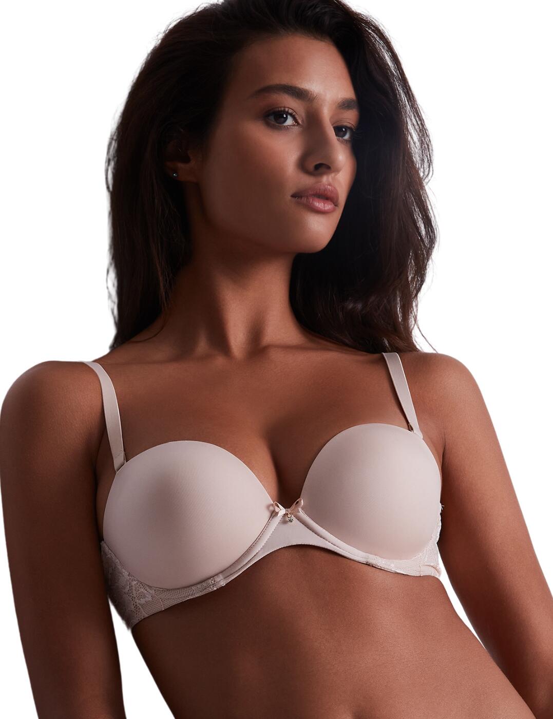 Try this gorgeous bra from the Sweetessence collection by Aubade and treat yourself to a truly versatile piece of lingerie. The bandeau style of this bra and the removable adjustable shoulder straps allow you to wear it as a standard bra or a strapless design. Add to it the smooth seamless material of the cups, and you can wear this piece to every occasion and rest easy as it will go well with any outfit. The underwired cups are moulded so that your bust is perfectly shaped and supported. As a finishing touch, this piece is decorated with delicate lace panels on the side and a pretty bow in the centre.  Bandeau design Heart-shaped neckline Lace panels on the sides Smooth material Bow and charm in the centre Moulded cups Underwired Adjustable and removable shoulder straps Hook and eye back closure Country of origin: Tunisia Composition lace: 72% Polyamide &pipe; 28% Elastane Composition lining: 100% Polyamide Composition back/side lining: 100% Polyester Composition mesh: 78% Polyamide &pipe; 22% Elastane Listed in UK sizes  59579-104296-1365793 IKP06 Moulded Bra