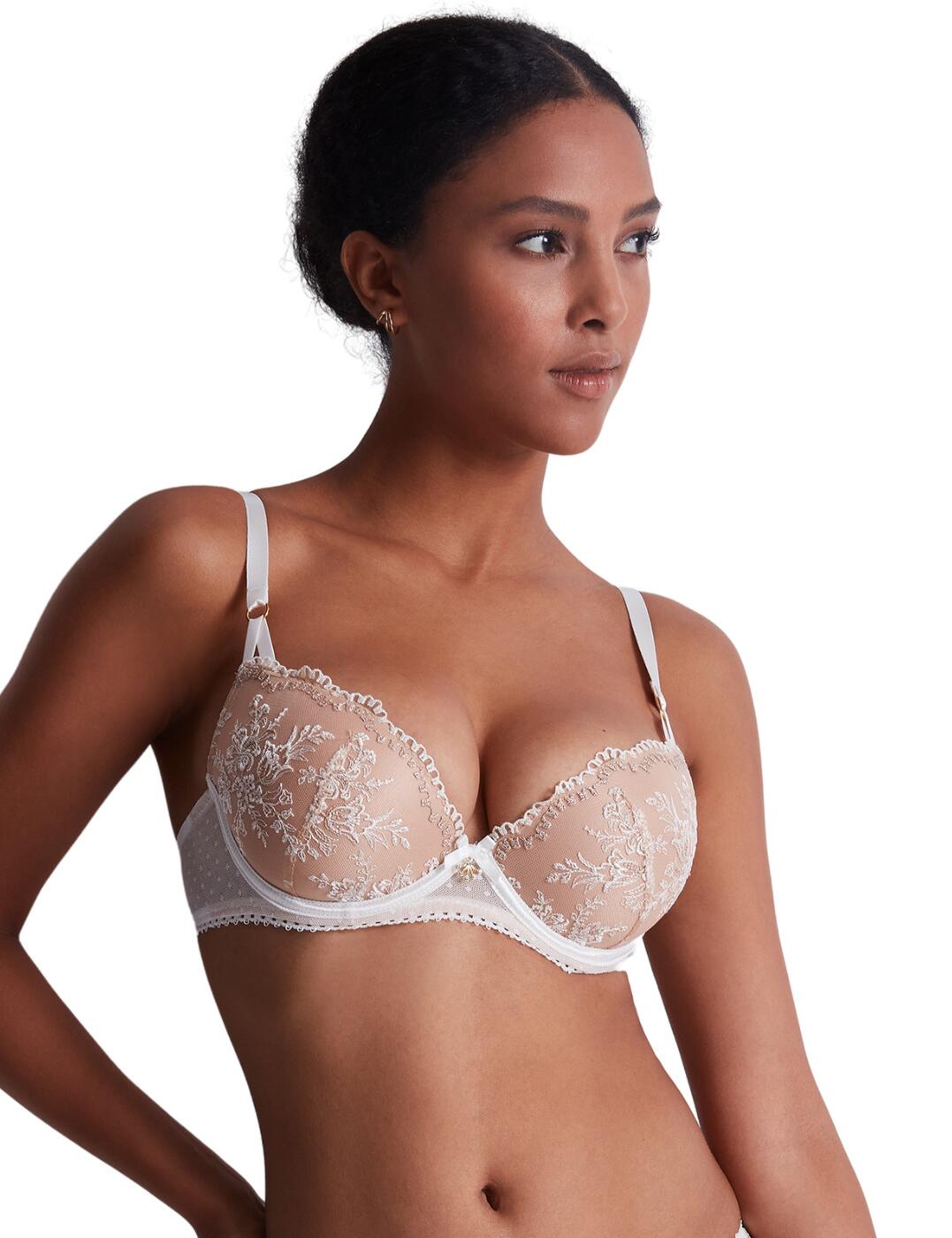 The Tresor Infini collection is a perfect example of how Aubade consistently delivers the most luxurious lingerie in gorgeous designs. This bra features a flattering deep plunging neckline accentuated by scalloped edges. The opaque cups are moulded and underwired to provide a perfect shape and support for your bust. This piece is decorated with a dotted pattern on a tulle band and stunning embroidery on the cups. Adjustable shoulder straps and traditional hook and eye back closure allow you to adapt this piece to your best fit. A golden charm in the centre finishes off this breathtaking design.  Gorgeous embroidery on the cups Deep plunging neckline with scalloped edges Sheer band with dotted pattern Satin straps with golden details Adjustable shoulder straps Hook and eye back closure Moulded cups Underwired Country of origin: Tunisia Composition cup embroidery: 70% Polyester &pipe; 23% Polyamide &pipe; 5% Elastane &pipe; 2% metallic thread Composition lining: 100% Polyester Composition tulle: 78% Polyamide &pipe; 22% Elastane Listed in UK sizes  59588-104318-1365580 IDN08 Moulded Bra