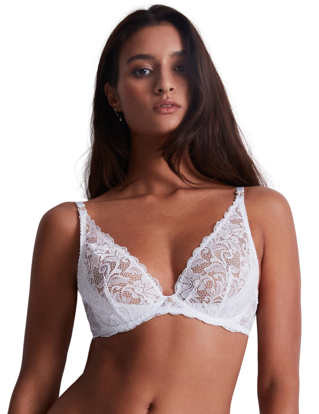 Aubade's Mon Bijou line introduces this must-have luxurious triangle bra needed in your lingerie collection. Be fashionable with this half-cup coverage triangle bra that provides a plunging neckline and underwired, non-padded cups for utmost support and comfort. This piece features a classic hook and eye fastening and adjustable straps so you can alter this piece to all your beautiful individual curves. Soft and delicate semi-sheer lace features on the upper cups to create a sophisticated yet seductive touch. Sexy and elegant, this design finishes with gorgeous scalloped edges and charm details at the base of each strap. Pair this luxe bra with any of the matching coordinates from Aubade Mon Bijou's range.  Triangle Bra Plunging neckline Underwired for support Non-padded Half cup coverage Adjustable straps Classic hook and eye fastening Delicate lace detailing Comfortable fit Charm details Matching coordinates available Country of origin: Madagascar Composition: Front Lace: 100% Polyamide Composition: Lace Back: 82% Polyamide &pipe; 18% Elastane Composition: Lining: 100% Polyamide Composition: Cup Lining: 74% Polyamide &pipe; 26% Elastane Listed in UK sizes  59593-104323-1365493 UAF12-6 Plunge Bra