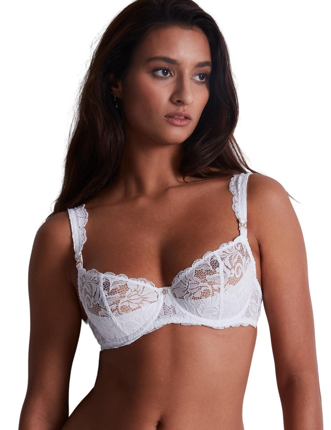 Introducing this luxurious half cup bra from Aubade's Mon Bijou line for a chic and timeless design you need in your lingerie collection. This piece has underwiring and non-padded cups for utmost support and comfort for daily wear while still having a flirtatious and seductive touch with its semi-sheer lace detailing across the upper cups. The delicate scalloped edges and charm accessory at the base of the strap is a perfect feature on the adjustable straps creating that feminity that Aubade is renowned for. Also features a classic hook and eye fastening for a secure fit for all your gorgeous curves. Take advantage of the matching available coordinates from Aubade's Mon Bijou range.  Half cup bra Non-padded Underwired for support Sexy semi-sheer lace detailing Gorgeous charm details Scalloped edges Adjustable straps Classic hook and eye fastening Matching coordinates available Country of origin: Madagascar Composition: Lace: 82% Polyamide &pipe; 18% Elastane Composition: Cup Lace: 100% Polyamide Composition: Lining: 100% Polyamide Composition: Cup Lining: 74% Polyamide &pipe; 26% Elastane Listed in UK sizes  59595-104326-1365519 UAF14-6 Half Cup Bra