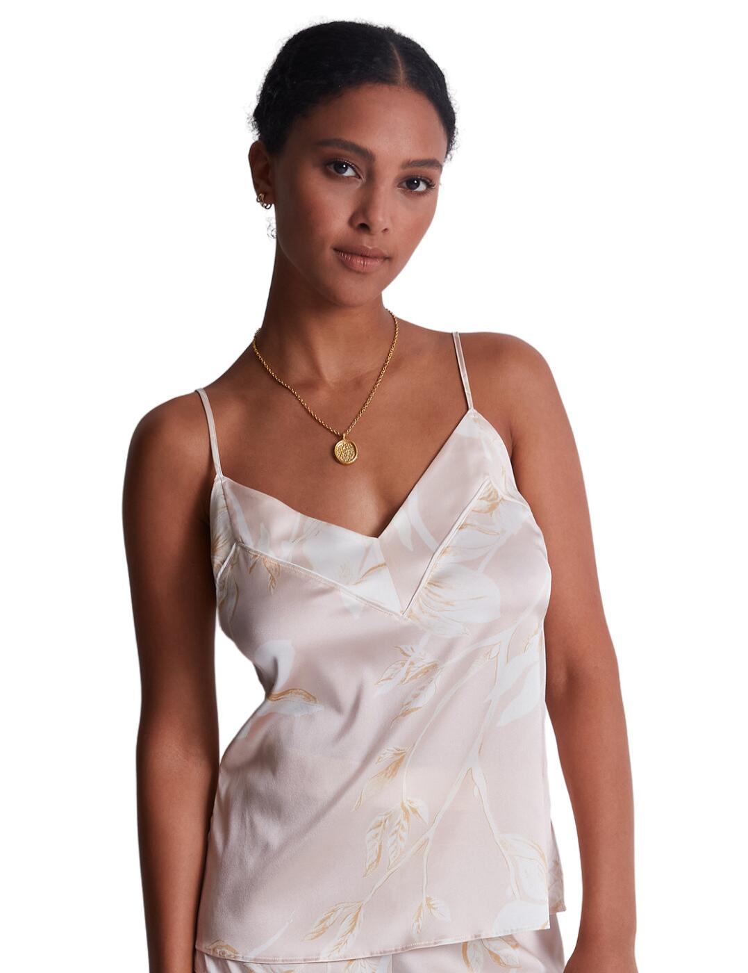 Stay sophisticated while you sleep with Aubade's Silk by Night collection. This silk cami is the perfect nightwear, made to ensure your beauty sleep is undisturbed by keeping you cool and comfortable all night. Featuring a teasing plunging neckline and adjustable spaghetti shoulder straps to create your desired fit. Feel elegant and feminine in luxurious fabric and perhaps couple with matching pieces found in the Silk by Night range.  Breathable Silk cami top Plunging neckline with triangle cups Thin adjustable shoulder straps Matching coordinates Country of origin: China Composition: 92% Silk &pipe; 8% Elastane Listed in UK size  59613-104348-1366588 RT38 Camisole Top
