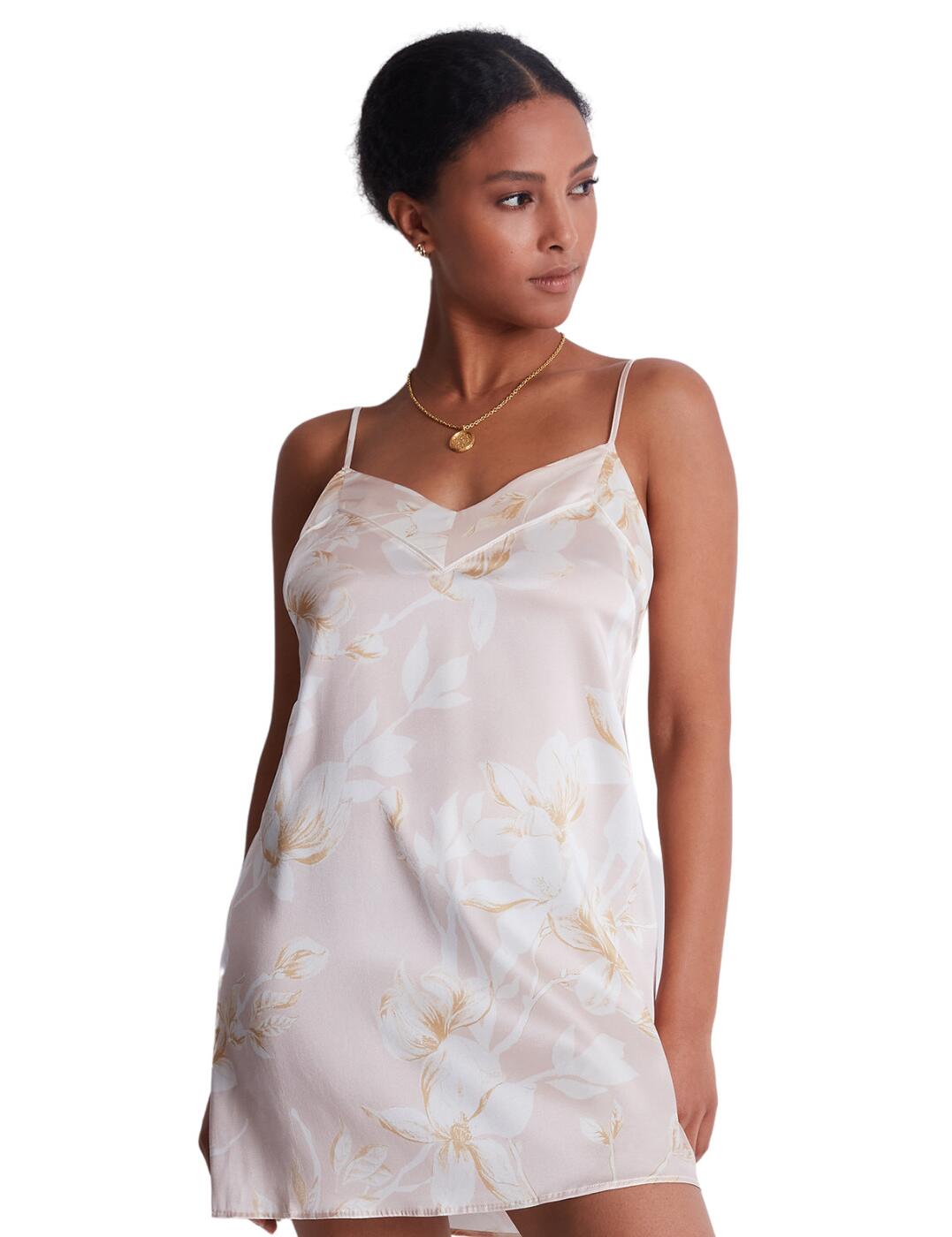 Feel glamorous while you lounge in Aubade's Silk by Night collection. This seductive nightdress is designed to be as premium as the sleep you deserve. Stay comfortable in the breathable silk material which should keep you cool and airy night after night. Featuring a classic plunging neckline and scooped back for ease of fit and showing off your gorgeous figure. Adjust the shoulder straps to your preference and go to bed feeling your best self.  Silk mini nightdress Plunging neckline with triangle cups Adjustable shoulder straps Scoop back for ease of fit Country of origin: China Composition: 92% Silk &pipe; 8% Elastane Listed in UK size  59614-104349-1366593 RT40 Nightie