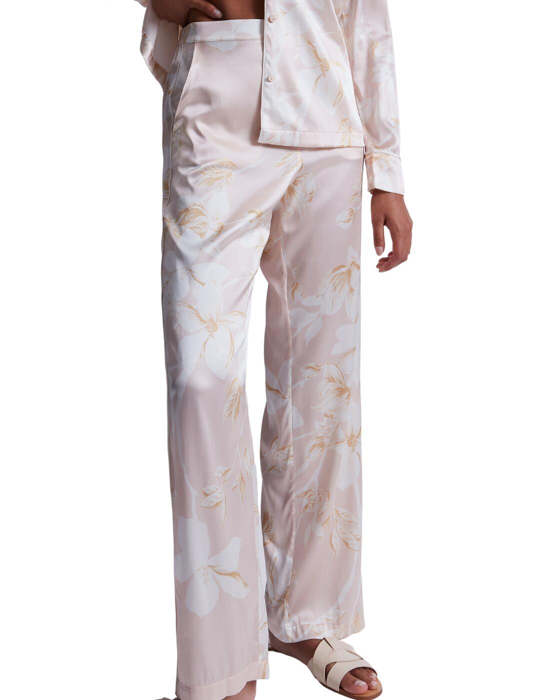 Feel relaxed in Aubade's Silk by Night collection. These long, loose pyjama pants are ideal for lounging around in comfort. Designed in a breathable silk fabric to stay lightweight on your body and feel luxurious. A high elasticated waist ensures a comfortable night's sleep and the perfect fit. The pyjama pants feature pockets for carrying your essentials and non-cuffed ankles for little restriction while wearing. Complete the look with other available items in the Silk by Night range.  Silk pyjama pants High elasticated waist Pockets Non cuffed ankles Long non fitted design Matching coordinates available Country of origin: China Composition: 92% Silk &pipe; 8% Elastane Listed in UK size  59619-104354-1366608 RT60 Pyjama Trousers