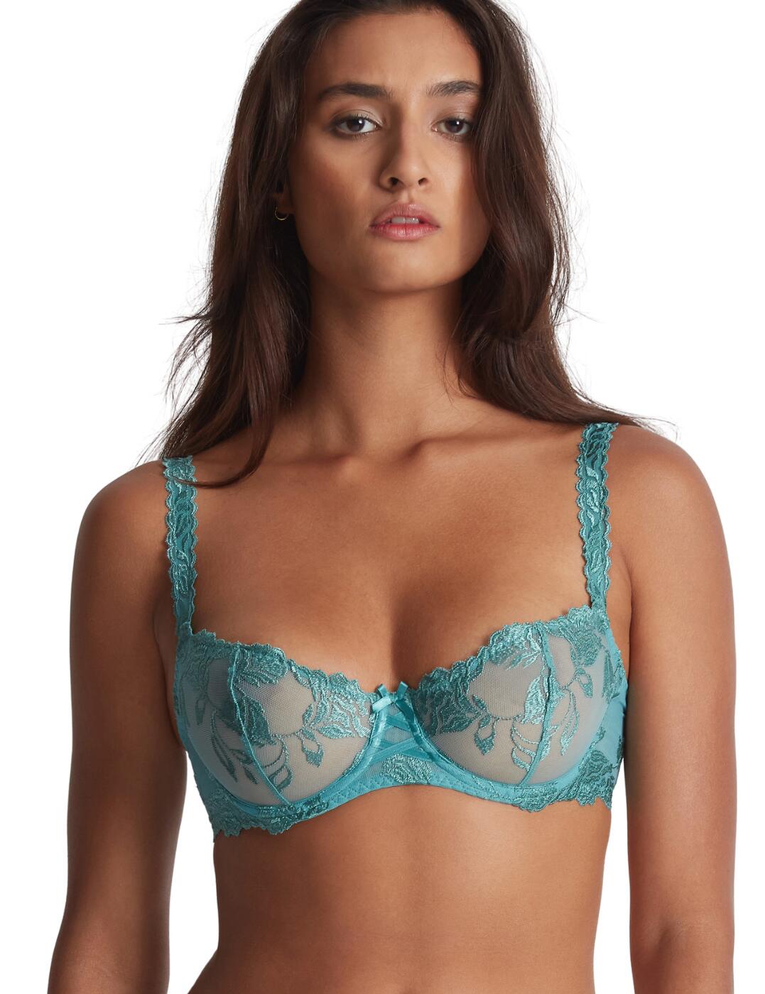 Upgrade your outfits with Aubade's premium Softessence collection. The half-cup bra is a perfect staple to add to your wardrobe, wearable every day while still giving you that sexy flair. Featuring a flower-embroidered design which feels like velvet and soft tulle for teasing transparency creating a feminine flirty look. The cups are designed to highlight the cleavage with the underwiring but overall still stay comfortable from the no padding and a wider back. Tailor this bra to you by adjusting the shoulder straps and hook and eye closure to your preference. Pair with coordinating items also found in the Softessence range to complete the look.  Half cup bra Flower embroidery Underwired for push design Non padded Wide back for support and comfort Adjustable shoulder straps Hook and eye closure Matching coordinates available Satin bow detail Country of origin: Tunisia Composition: Embroidery: 47% Polyester &pipe; 38% Polyamide &pipe; 15% Elastane Composition: Lining: 100% Polyamide Listed in UK size  59633-104368-1366650 TMF14 Half Cup Bra