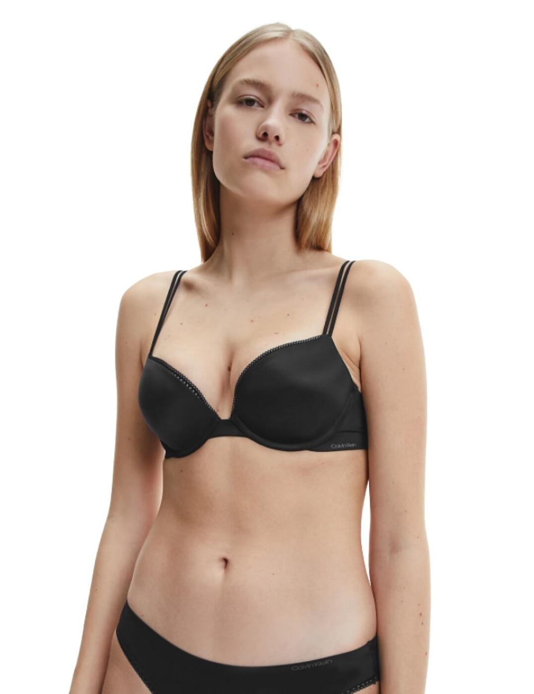 A modern and seductive design features on this Liquid Touch bra from Calvin Klein. Designed for the most comfortable wearing experience, this bra has liquid silicone wings that will leave no marks and wraps fluidly around the body. The cups are padded with a push-up effect on a plunging neckline for a brilliant accentuation of the cleavage. Double straps and lace trims give this bra a feminine and distinctive touch.  Modern and feminine design Liquid silicone wings Padded, push-up cups Underwired Plunge neckline with lace trims Double straps, adjustable Hook and eye closure Composition: 63% Nylon &pipe; 37% Elastane Listed in UK sizes  48586-88203-1167879 QF4083E Push Up Bra
