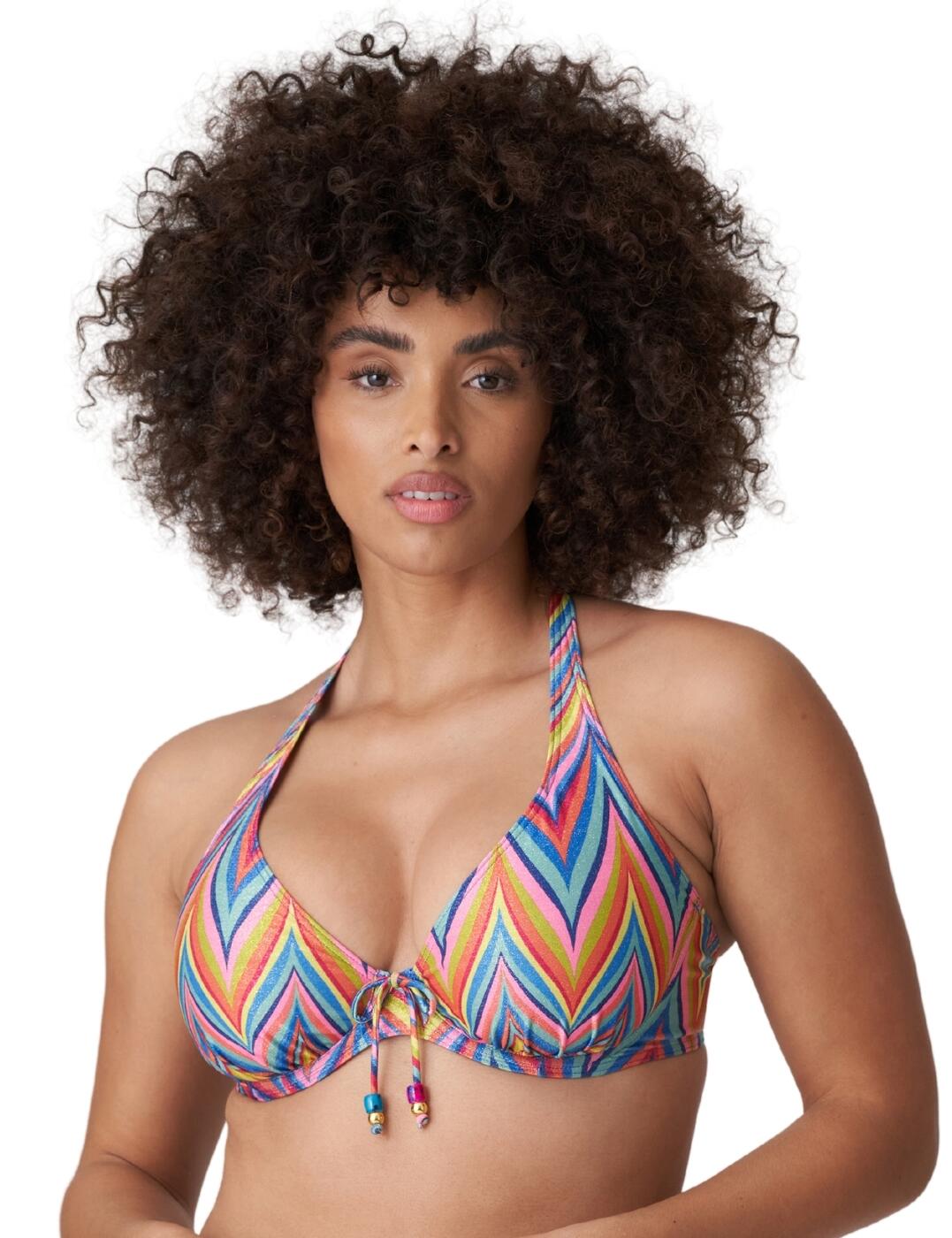 The 70's inspired Kea collection by Prima Donna will add a touch of glamour to your luxury swimwear collection. This stylish bikini top features a low plunging neckline to highlight your cleavage and the half-padded cups create uplift and volume. Convertible shoulder straps allow you to wear it in a classic over-the-shoulder style or chic halterneck design which emphasises your cleavage. The bold print creates a glamourous 70's inspired look and the metal fibre creates a shimmering finish. Underwiring offers additional support and the clip fastening ensures a secure fit. Pair with stylish coordinating swimwear and accessories from the luxurious Kea collection.