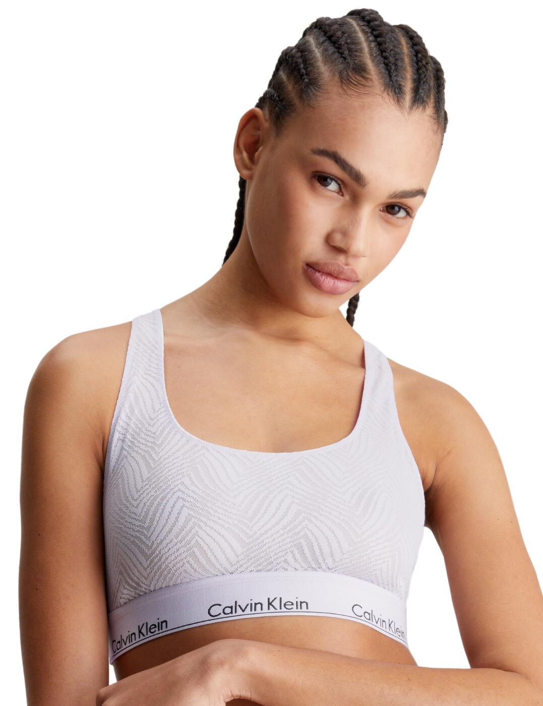 Presenting the Calvin Klein gorgeous bralette, a blend of comfort and style with its unlined, wireless design, and racerback feature. This fashion-forward bralette offers unique patterns and the classic Calvin Klein underband for support and luxury. Available in matching sets, it's designed for the confident, modern woman looking to elevate her lingerie collection with timeless elegance.