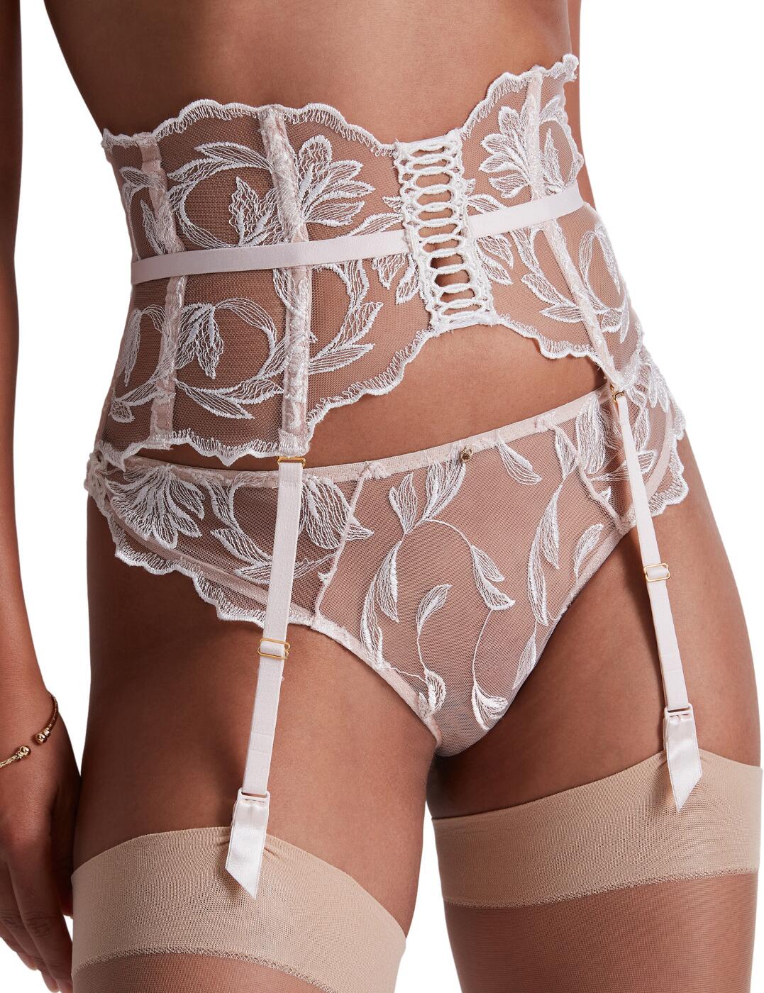 Be bold and sexy this season with this flattering waist cincher from Aubade's Season of Love collection. This secure fit is adjustable and has a classic hook and eye fastening to allow you to tailor it to all your stunning curves. This design is made from a beautiful sheer mesh material with delicate lace detailing and scalloped edges for that sophisticated and elegant touch. Feel amazing and take advantage of the matching available coordinates from Aubade's luxurious Season of Love range.  Waist cincher Adjustable garter straps Flattering fit Beautiful lace detailing Scalloped edges Hook and eye fastening Matching coordinates available Country of origin: Tunisia Composition embroidery: 78% Polyester &pipe; 22% Polyamide Composition middle embroidery: 100% Polyester Listed in UK sizes  59681-104426-1367153 LC52 Suspender Belt