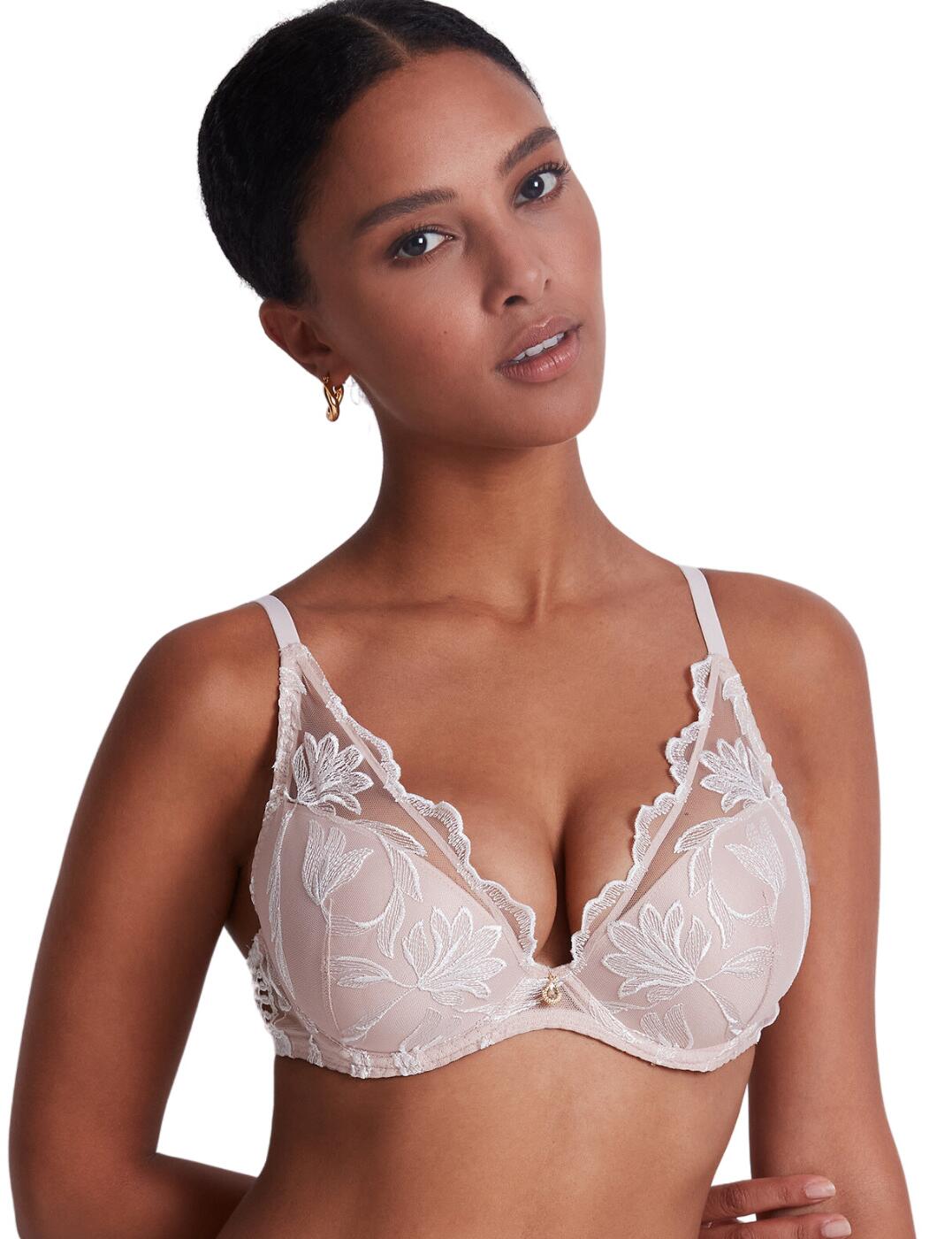 Add some luxury to your lingerie collection with the Season of Love line from Aubade. Introducing this push-up bra which provides amazing uplift, while still maintaining a comfortable fit. Thanks to the underwired padded cups, your bust is flawlessly shaped and supported. This piece also features a classic hook and eye fastening and adjustable straps providing a perfect, flattering fit to your curves. This design has a beautiful lace overlayer and delicate scalloped edges for that sophisticated and elegant touch. To complete this set, Pair with the matching available coordinates from Aubade's Season of Love range.  Push-up bra Plunging neckline Sheer lace overlayer Padded Underwired Adjustable straps Classic hook and eye fastening Charm detail in the centre bust Scalloped edges Matching coordinates available Country of origin: Tunisia Composition embroidery: 51% Polyester &pipe; 40% Polyamide &pipe; 9% Elastane Composition cup embroidery: 67% Polyester &pipe; 27% Polyamide &pipe; 6% Elastane Composition side embroidery/lining: 100% Polyester Listed in UK sizes  59686-104431-1367192 LCN81 Push Up Bra