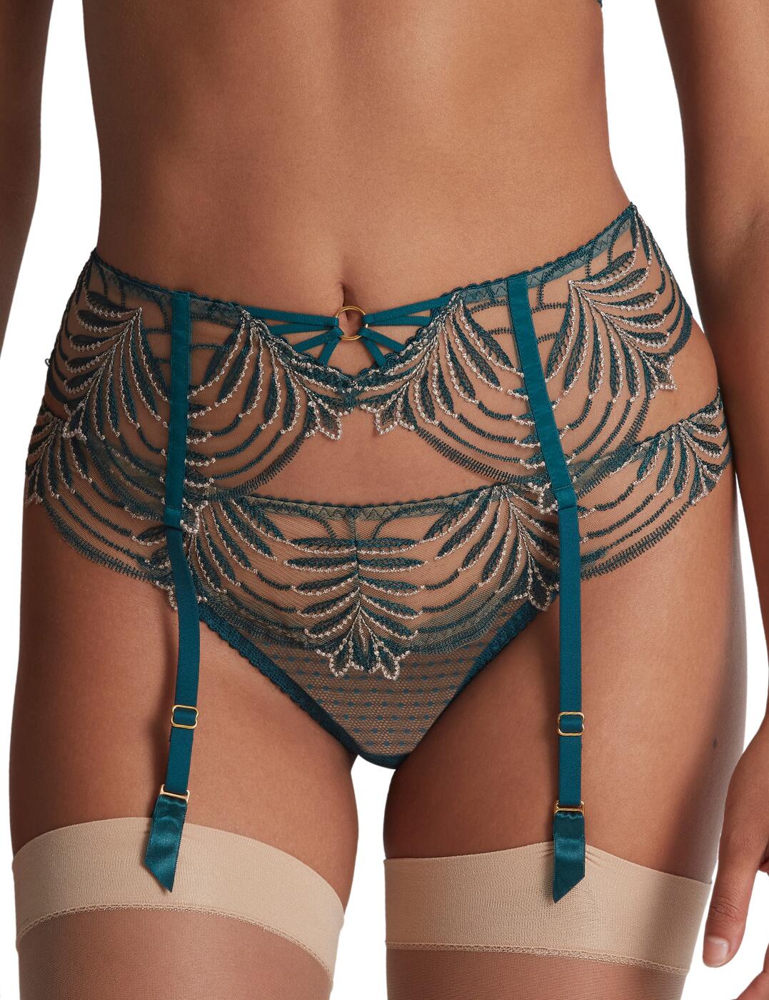 Bring the stunning Hypnolove look together with this flattering suspender belt from Aubade's luxurious line. Featuring a classic hook and eye fastening and adjustable garter straps for that perfect fit to all your amazing curves. This must-have design is eye-catching with its beautiful embroidered details, strappy design in the centre front and dot embroidered tulle finish. To complete this sexy and seductive look, pair with any of the matching available coordinates from the Aubade Hypnolove range.  Suspender belt Beautiful embroidered detail Strappy details Dot tulle Hook and eye fastening Adjustable garter straps Flattering fit Matching coordinates available Country of origin: Tunisia Composition embroidery: 77% Polyester &pipe; 23% Polyamide Composition tulle: 77% Polyamide &pipe; 23% Elastane Listed in UK sizes  59694-104439-1367247 LD50 Suspender Belt