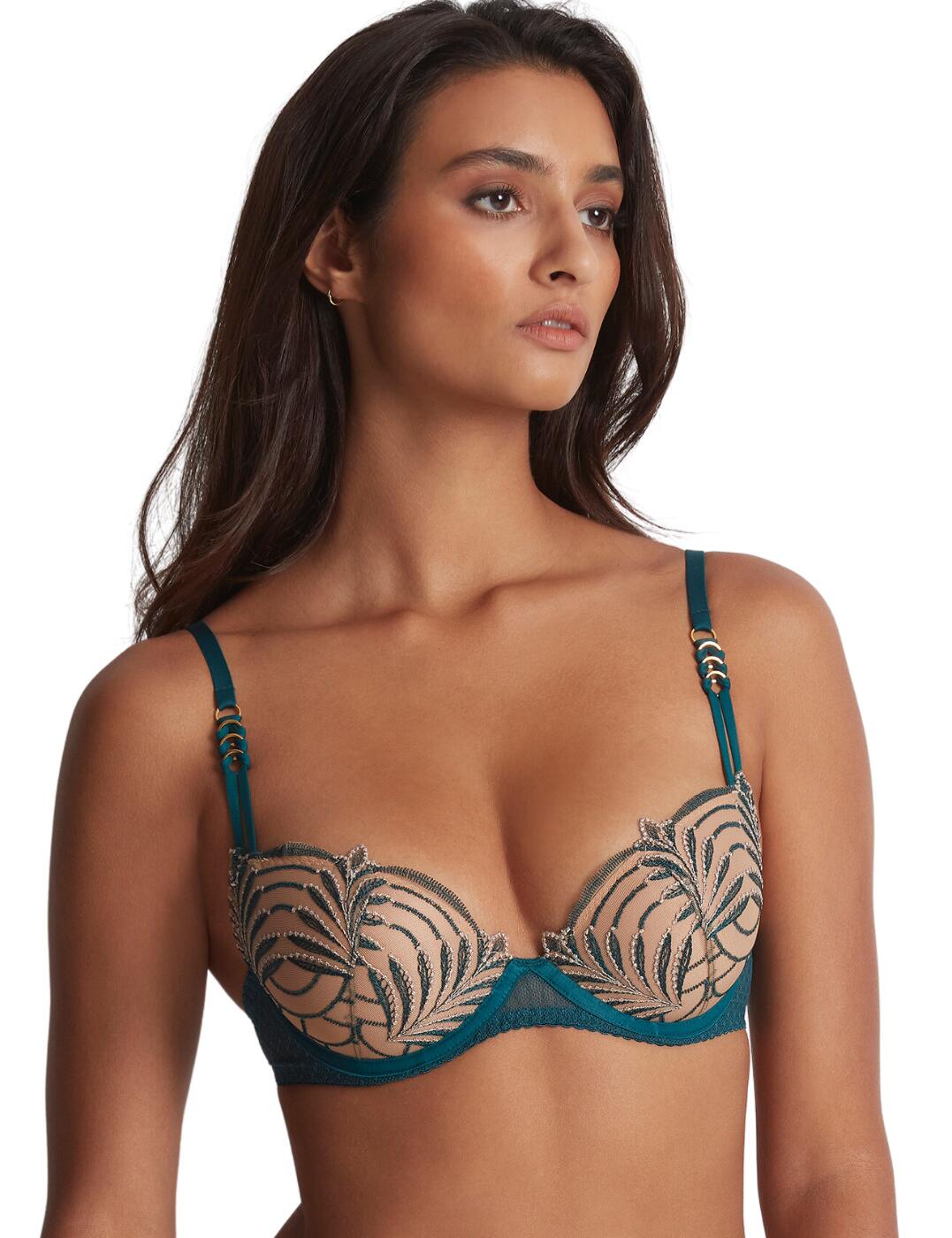 Showcase your assets with this stunning moulded push-up bra from Aubade's luxurious Hypnolove collection. Padded and underwired for the utmost support and uplift creating a beautiful silhouette and cleavage. This piece also features a classic hook and eye fastening and adjustable straps with gorgeous detailing on them for an elegant and secure fit to all your natural curves. Feminine embroidery and timeless dot details are crafted onto this sophisticated design for that perfect finish. To complete this set, take advantage of the matching coordinates available from the Aubade Hypnolove range.  Moulded push-up bra Embroidered details Padded Underwired Gorgeous strap detailing Adjustable straps Traditional hook and eye fastening Scalloped edges Dot tulle mesh Matching coordinates available Country of origin: Tunisia Composition cup embroidery: 63% Polyester &pipe; 24% Polyamide &pipe; 13% Elastane Composition lining: 100% Polyester Composition tulle: 77% Polyamide &pipe; 23% Elastane Listed in UK sizes  59698-104443-1367609 LDN08 Push Up Bra