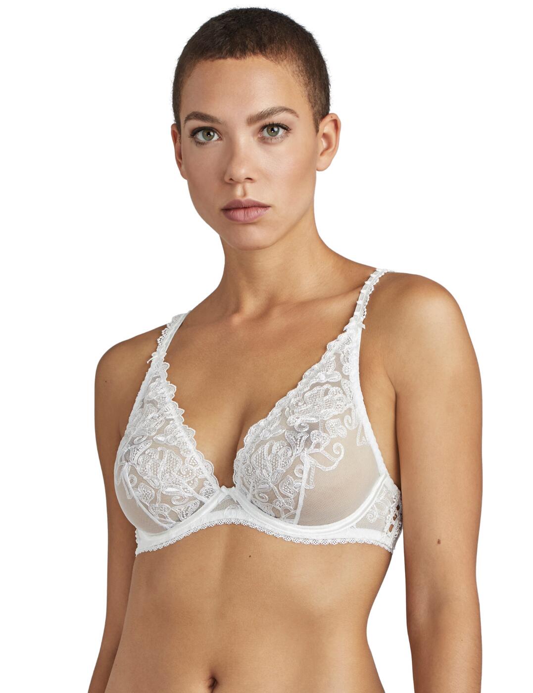 The Pour Toujours bridal collection combines traditional style with modern designs to help you feel special on your big day! This plunging triangle bra has a deep neckline and non-padded transparent fabric shows a hint of skin for a seductive style. A traditional guipure motif embroiders the cups and with bridal wear, buttons give an extra special detailing, adding a vintage touch. Adjustable straps offer an individual fit and the underwiring creates support. Complete your look with matching items available from the Pour Toujours range by Aubade.  Floral embroidery Classic triangle shape Bridal button detailing Underwiring for support Adjustable straps for a unique fit Composition: 42% Polyester &pipe; 41% Polyamide &pipe; 17% Elastane Listed in UK sizes  48673-88351-1171106 TC12 Plunge Bra