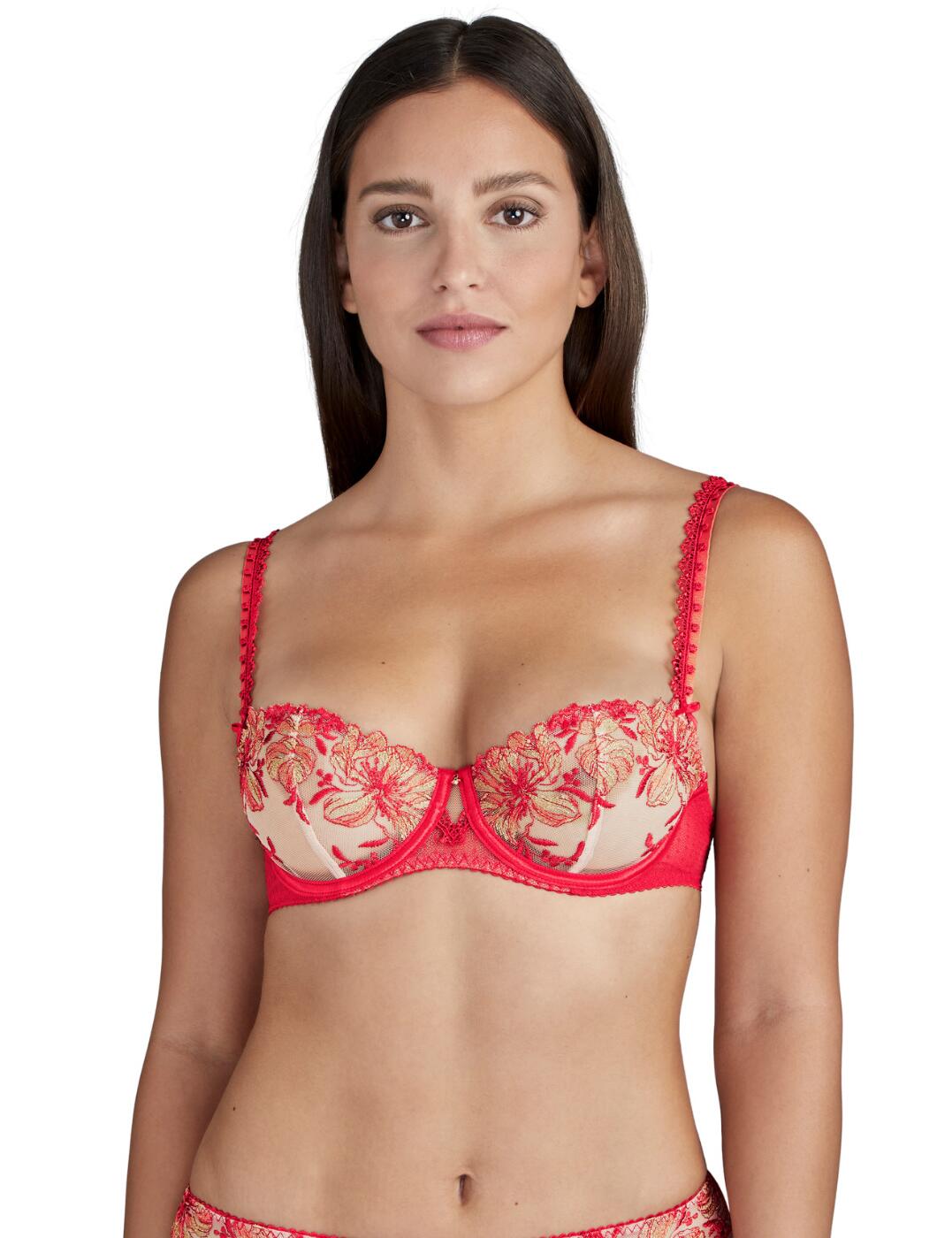 The Poetique Esquisse collection uses Aubades timeless designs and floral tattoo inspired embroidery creating a modern feminine lingerie line. This half-cup bra flaunts sensual style with embroidered tulle which shows a hint of skin and the central rhinestone adds a touch of luxury. Vertical seaming adds a lifting effect and the lace-trimmed cups creates a sexy cleavage. Underwiring adds support and the adjustable straps create an individual fit. Perfect your look with matching items available from the Poetique Esquisse range by Aubade.  Feminine floral embriodery Seductive half-cup design Transparent non-padded tulle cups Underwiring adds support Adjustable straps for a unique fit Composition: 77% Polyamide &pipe; 23% Elastane  Listed in UK sizes  48734-88445-1180315 TF14 Half Cup Bra