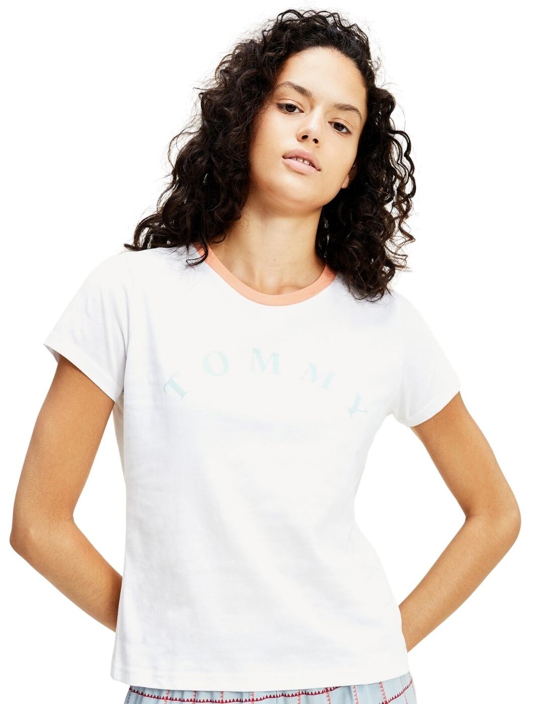 Lounge in this classic Tee. This Tommy Hilfiger T-shirt designed with organic cotton and a regular fit means there will be nothing comfier in your t-shirt collection. With the classic slogan across the front and the contrasting collar and cuffs, you can style it with any outfit.  Tommy Hilfiger branding Crew neckline Regular fit Organic cotton is kind to the environment Tommy Hilfiger flag embroidery on sleeve Composition: 100% organic cotton Listed in UK sizes  46376-85105-1146369  Slogan Top