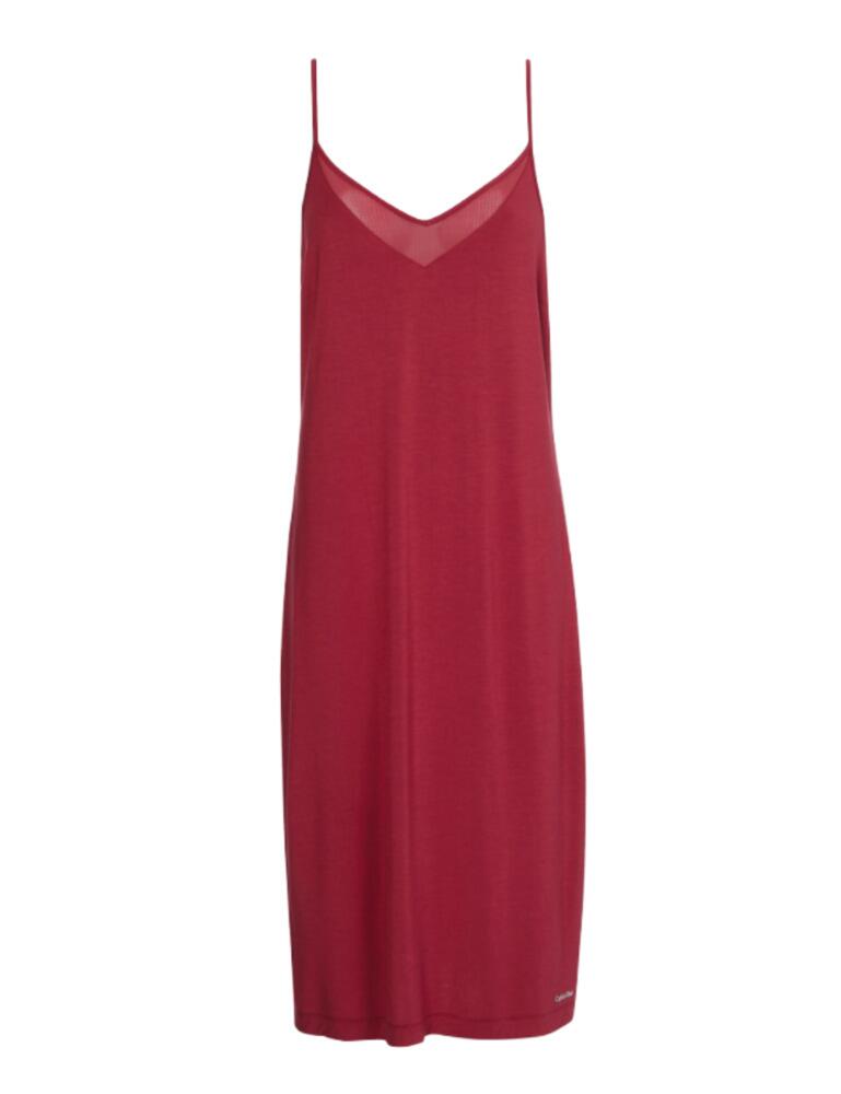Calvin Klein is iconic for minimal designs that are sleek and elegant. This chemise offers you the utmost luxurious comfort in a refined style. A mesh panelled neckline detail adds a seductive feel combined with the sexy revealing low V back. The softest stretch jersey fabric will create the perfect night's sleep and the discrete Calvin Klein logo adds designer style. Wear with matching items from the Perfectly Fit Flex collection from Calvin Klein for an elegant coordinated look.  Sexy mesh neckline detail Elegant midi length Calvin Klein printed logo Seductive low V back Soft stretch fabric Composition: 94% modal &pipe; 6% elastane Listed in UK sizes  48975-88835-1180744 QS6542E Chemise