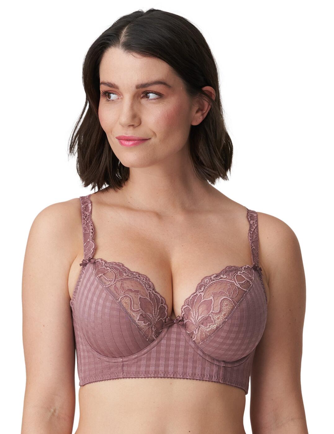 This stunning Prima Donna Madison deep plunge balcony bra really gives you the wow factor. This eye-catching longline bra has plunging cups, combined with a trendy look to create an impeccable fit. The wired cups are split with fabric cups and lace detail. The chequered pattern throughout this bra makes it a must-have statement piece. The adjustable straps are trimmed with lace to create that feminine feel, along with detailed bows added to make it extra pretty. The back of the bra is met by an adjustable hook and eye fastening, which is doubled up to ensure optimum support.  Plunge neckline Balcony cups Lace detail Underwired Double hook and eye fastening Round cups for an impeccable fit Adjustable straps Composition: 81% Polyamide &pipe; 19% Elastane  Listed in UK sizes  50404-91250-1203051 0262126 Balcony Bra