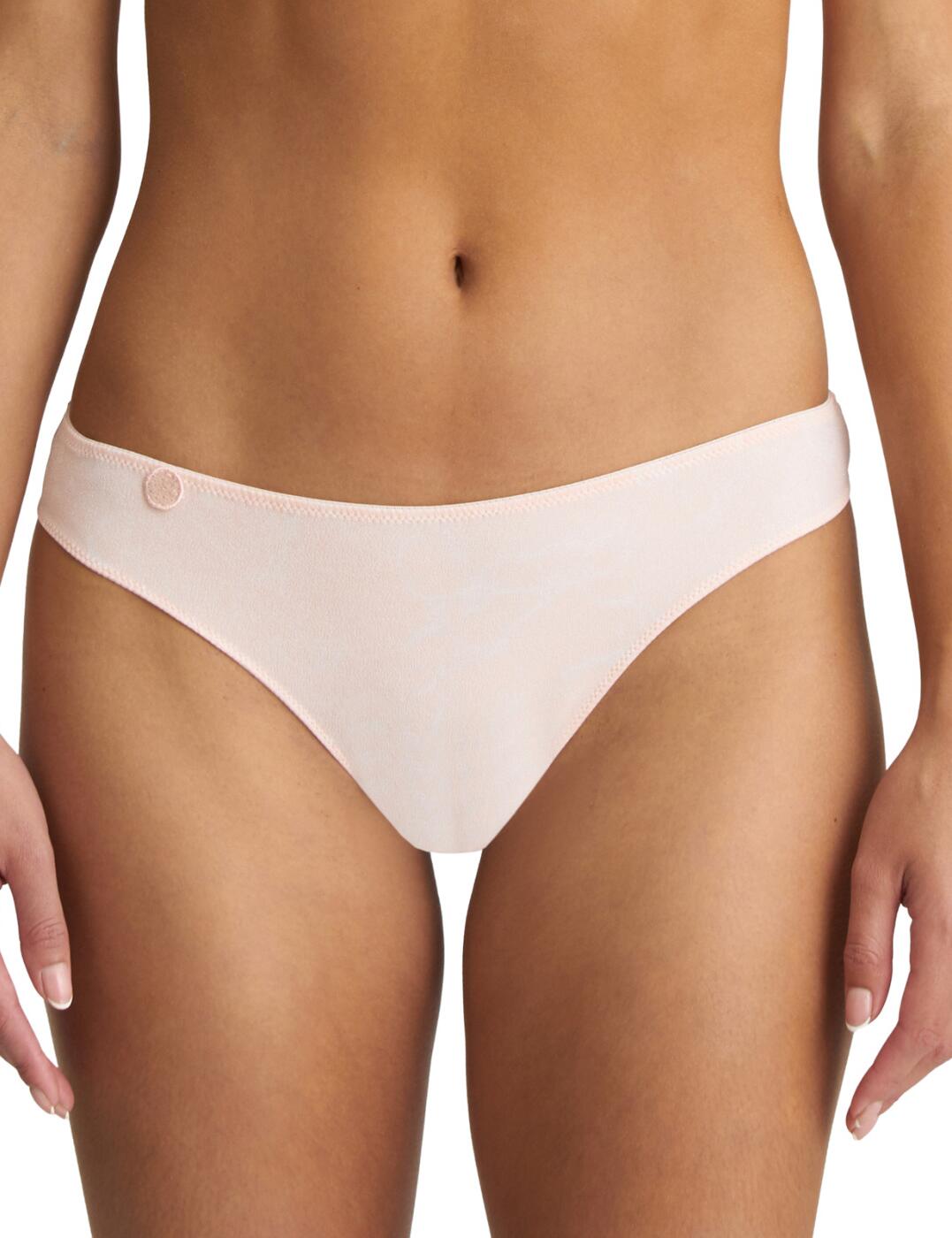 The Tom thong by Marie Jo is crafted from super soft tulle fabric that contours to the body like a second skin. The minimalistic design showcases your curves and is easily concealed under most clothing. A small embroidered motif decorates one side of the thongs. The lightweight fabric will keep you feeling comfortable all day.  Lightweight fabric Minimal rear coverage Flattering style Mid-rise Matching co-ordinates available Country of origin: Tunisia Composition: Polyester 78% &pipe; Elastane 13% &pipe; Cotton 9% Listed in UK sizes  54488-97499-1264647 0620820 Thong