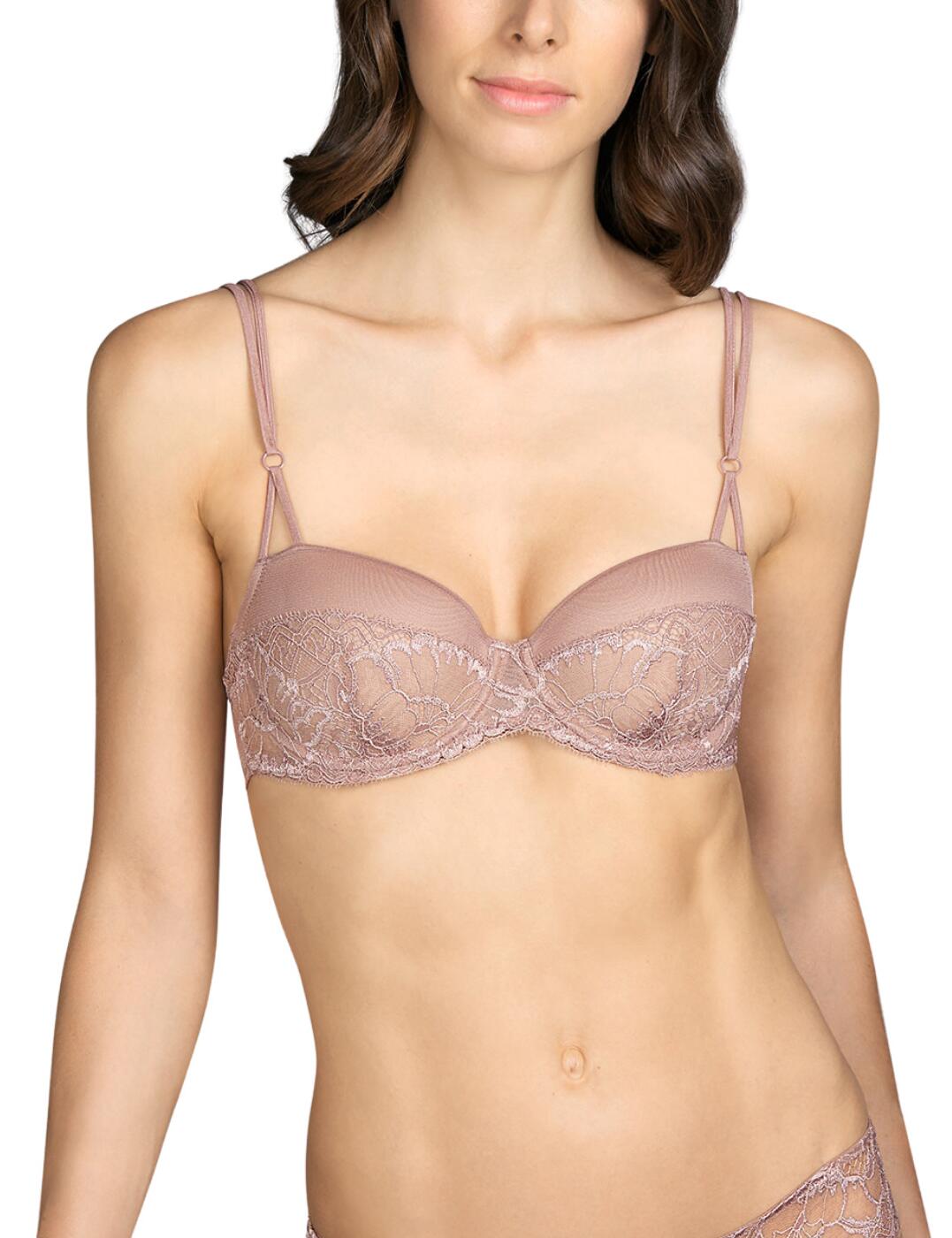 This balcony bra from Andres Sarda's Mini collection could be just what you were looking for. With elegant lace to add a feminine touch. The double straps, featuring a small tone-to-tone decorative ring, can be adjusted along with the hook and eye closure to provide a perfect fit. Padding on the cups creates a naturally rounded shape while centering the breasts. This bra along with matching coordinates could soon become an everyday essential.  Hook and eye closure Padded Double straps that adjust Small decorative ring Composition: 67% Polyester &pipe; 30% Polyamide &pipe; 3% Elastane Listed in UK sizes  49244-89247-1192147 3309214  Padded Balcony Bra