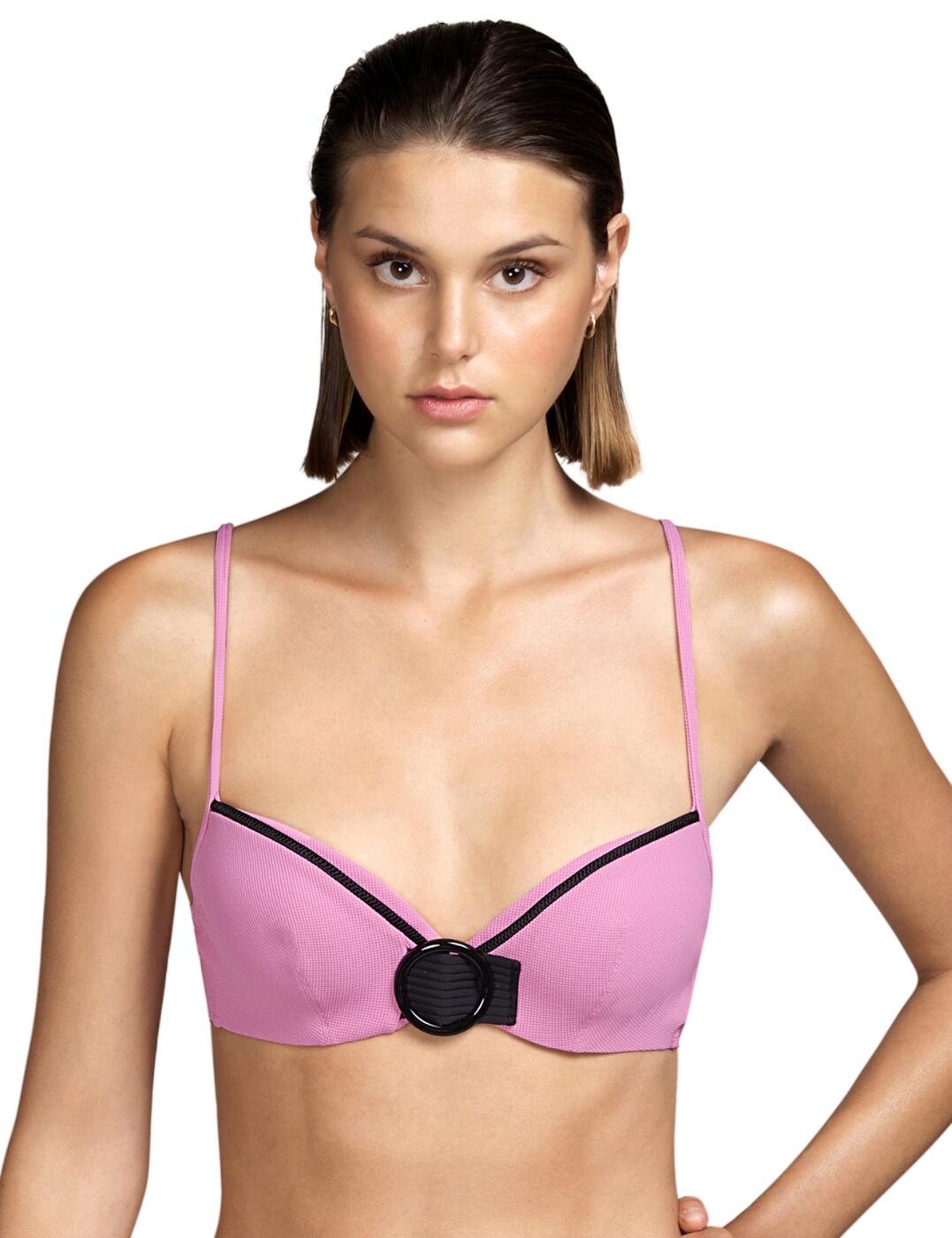 This bikini top is a part of the Coco range by Andres Sarda which introduces luxury swimwear with a retro touch. The bikini top has padded cups that help enhance your cleavage whilst the bikini still provides full coverage and is underwired for a supportive fit. It rounded shaped cups with naturally centre your breasts. The bikini has piping detailing at the top of the cups which contrasts with the block colour of the bikini. It closes at the rear with a hook and eye closure and the thin straps are adjustable allowing for an individual fit. Finished off with a circle tie detail at the centre.  Luxury swimwear Padded cups that enhance your cleavage Full coverage Underwired for a supportive fit Rounded cups that naturally centre your breasts Piping detailing Hook and eye closure Thin adjustable straps Circle tie detail Country of Origin: Tunesia Composition: 62% Polyamide &pipe; 29% Polyester &pipe; 9% Elastane  Listed in UK sizes  54635-97474-1264812 3409516 Balcony Bikini Top