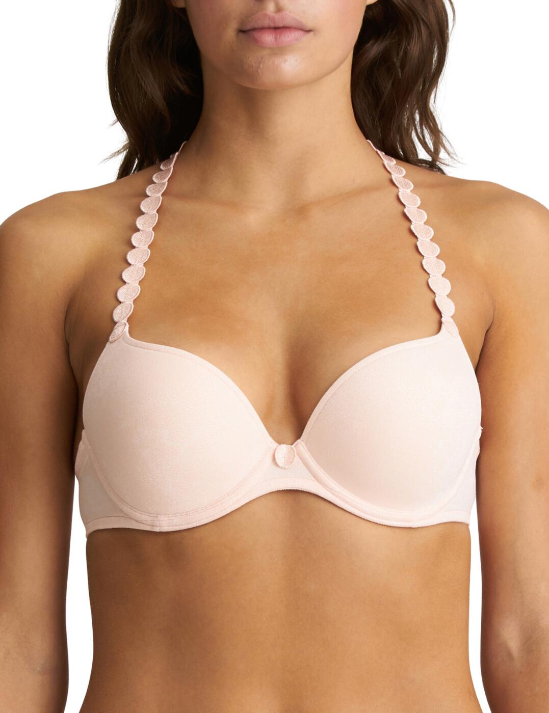 A new spin on the classic Marie Jo design - this Tom bra is just what you need. The pushup effect of the padded cups is ideal for ladies that want just a bit more uplift to their bust, and together with the underwiring, it provides a beautiful shape that comfortably supports your chest. The deep plunging neckline creates an alluring decolletage, while the smooth material helps this bra remain invisible under clothing. The adjustable shoulder straps can be worn in multiple designs and are decorated with the iconic Marie Jo detailing. Matching round component features in between the bust, completing the look.  Deep plunging neckline Classic Marie Jo decorative floral details Underwired and padded (push-up effect) Adjustable multiway shoulder straps Hook and eye back closure Matching coordinates available Country of origin: China/Nanhai Composition: 86% Polyester &pipe; 8% Polyamide &pipe; 6% Elastane Listed in UK sizes  54656-97500-1264677 0220827 Push Up Bra
