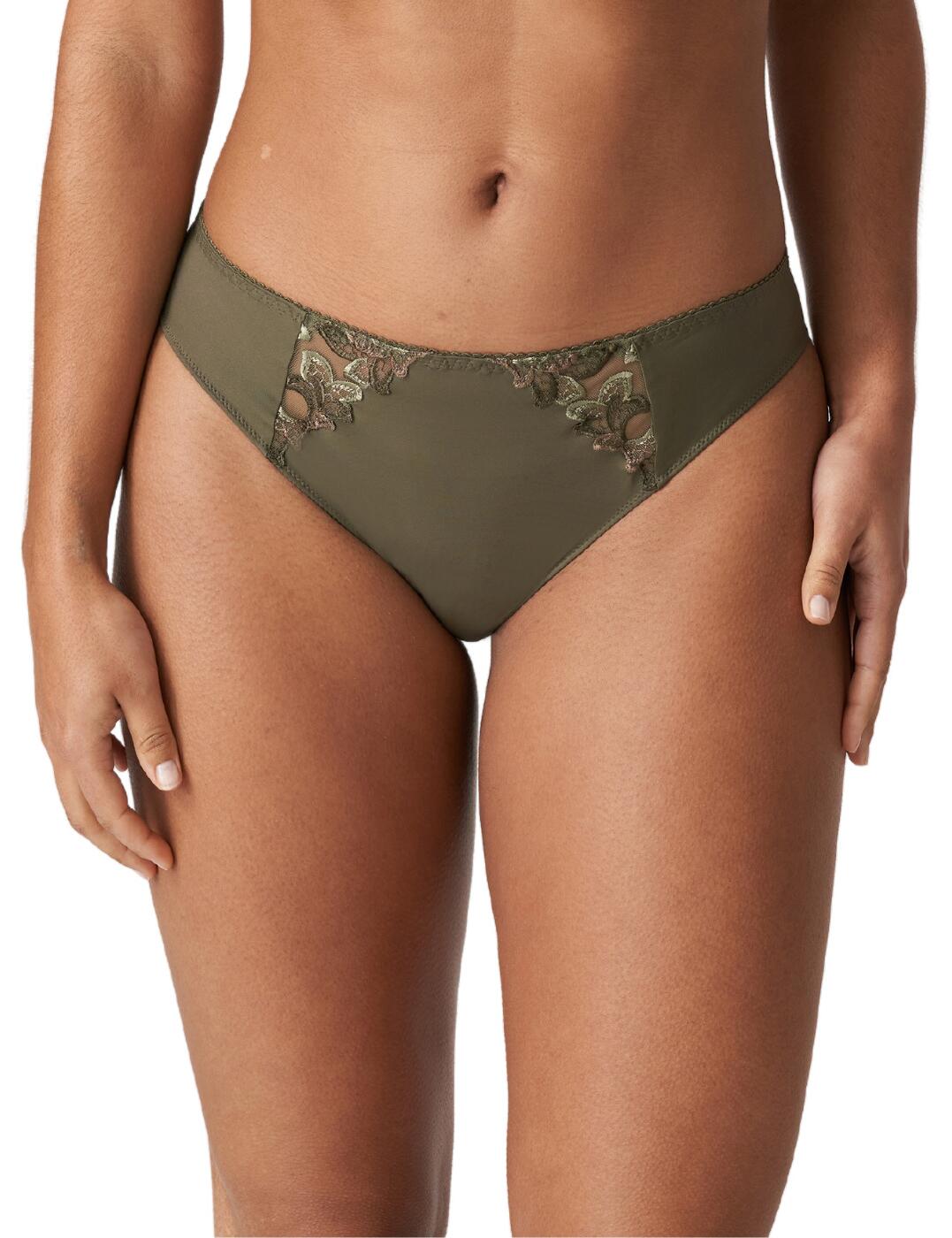 The elegance of these Deauville thongs from Prima Donna combines with the classic design to give you an obvious choice for your everyday underwear. The simplistic design and the soft material make this piece incredibly comfortable to wear, while the gorgeous floral embroidery panels on the front sides allow for a luxurious touch. Match with other coordinating items from the gorgeous Deauville collection for a fully coordinated look.  Floral embroidery on the front sides Soft stretch material Mid-rise waist Minimal rear coverage Matching coordinates available Country of origin: Tunisia Composition: 59% Polyamide &pipe; 25% Elastane &pipe; 9% Cotton &pipe; 7% Polyester  Listed in UK sizes  55704-99188-1285789 0661815 Thong