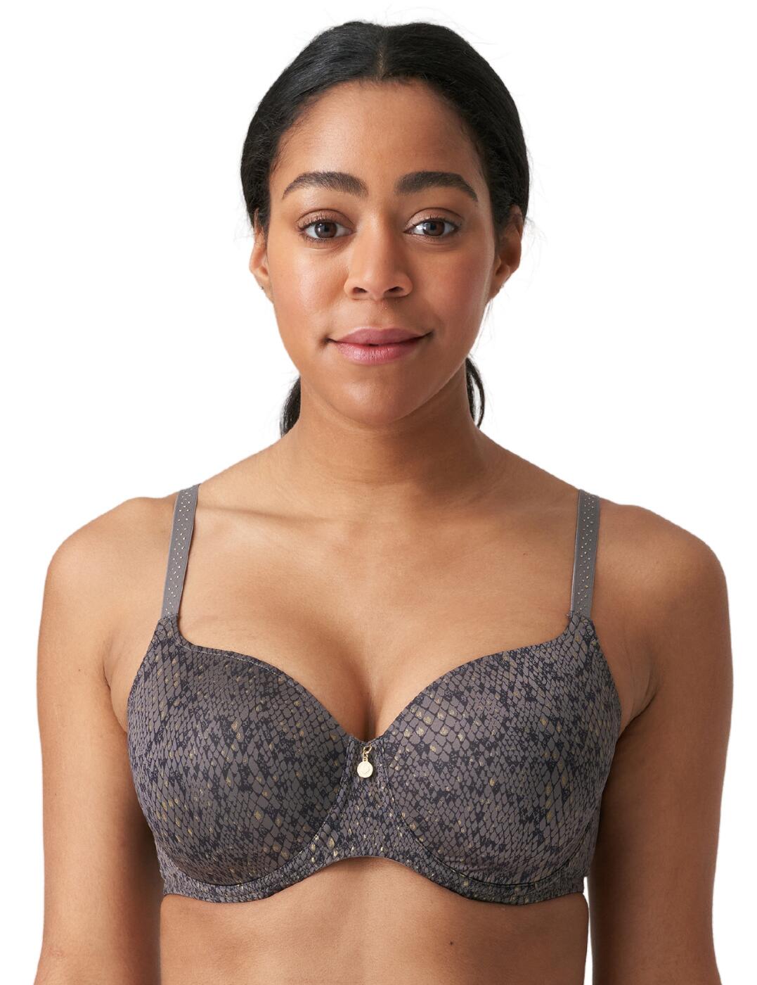 Make everyday glamourous with this luxurious t-shirt bra from the Villemin collection by Prima Donna Twist. The premium shimmery fabric will definitely draw all eyes to you and the gold look studs add to the luxurious style. The classic t-shirt design is smooth for an invisible finish and the added padding creates uplift and volume. Underwiring offers added support and the adjustable shoulder straps ensure the perfect individual fit. Wear with flirty coordinating briefs from the luxurious Villemin range by Prima Donna Twist.  Glamourous shimmery fabric Classic T-shirt shape Padded cups Gold look stud details Underwired Adjustable shoulder straps Hook and eye fastening Small fit: Size up one cup size from your usual Prima Donna size Country of origin: China Composition: 54% Polyester &pipe; 36% Polyamide &pipe; 10% Elastane Listed in UK sizes  55725-99212-1285480 0242130 Padded T-Shirt Bra