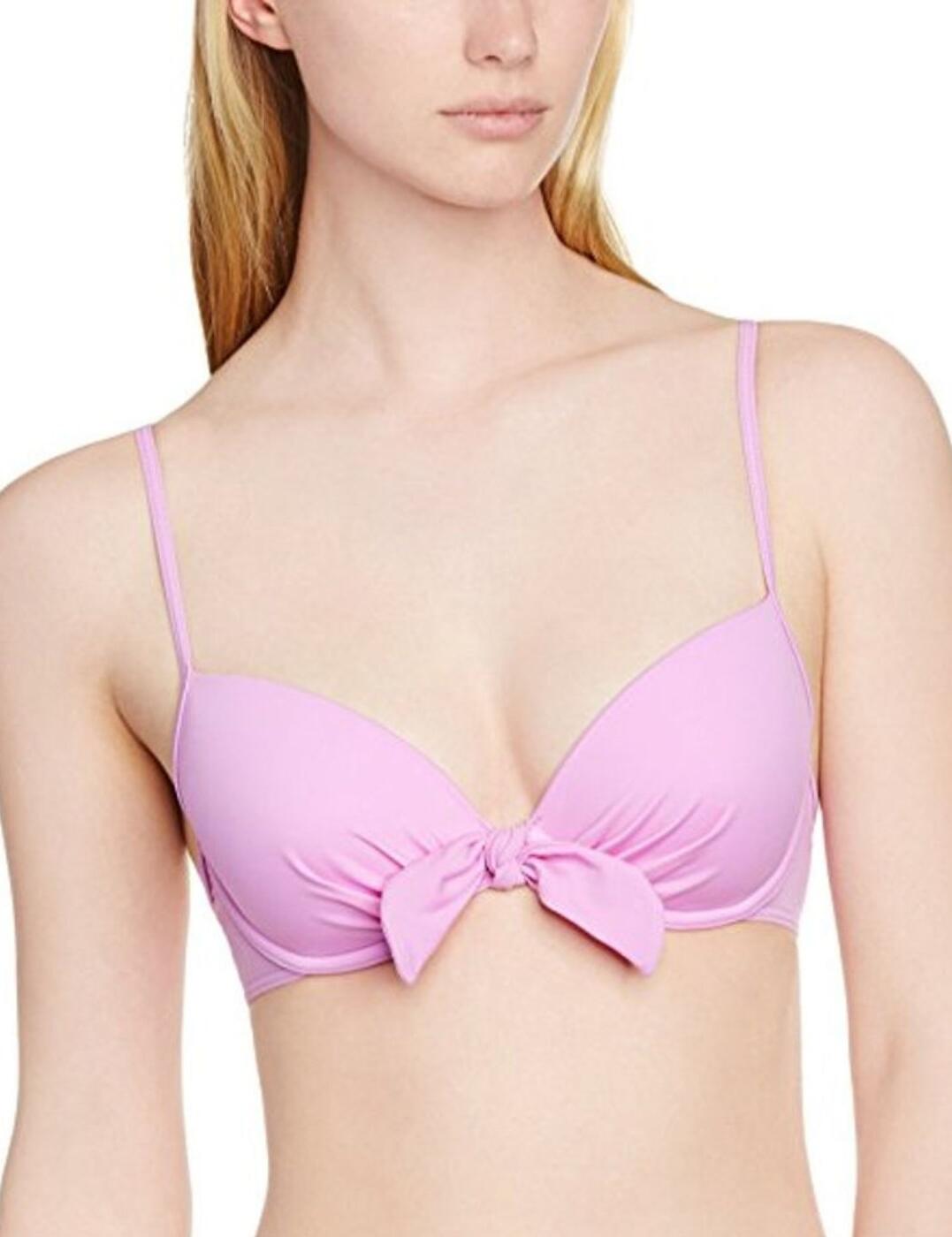 This bikini top from the Bow collection at Lepel is super girly and beautifully delicate with all the features you want for a feminine swimwear look. The cups are padded with a plunging neckline and underwire to accentuate a nice cleavage. The front is finished with flattering gathers on the cups and an oversized tie front detail. The straps and back are slimmer for a delicate and lightweight feel. Pair this with the matching bikini briefs for the ultimate cute swimwear.  Girly and delicate design Padded cups Underwired Plunging neckline Tie and gathering details Slim, adjustable straps Small clasp fastening at rear Composition: 82% Polyamide &pipe; 18% Elastane Listed in UK sizes  49619-89774-1188248 1356600 Padded Plunge Bikini Top