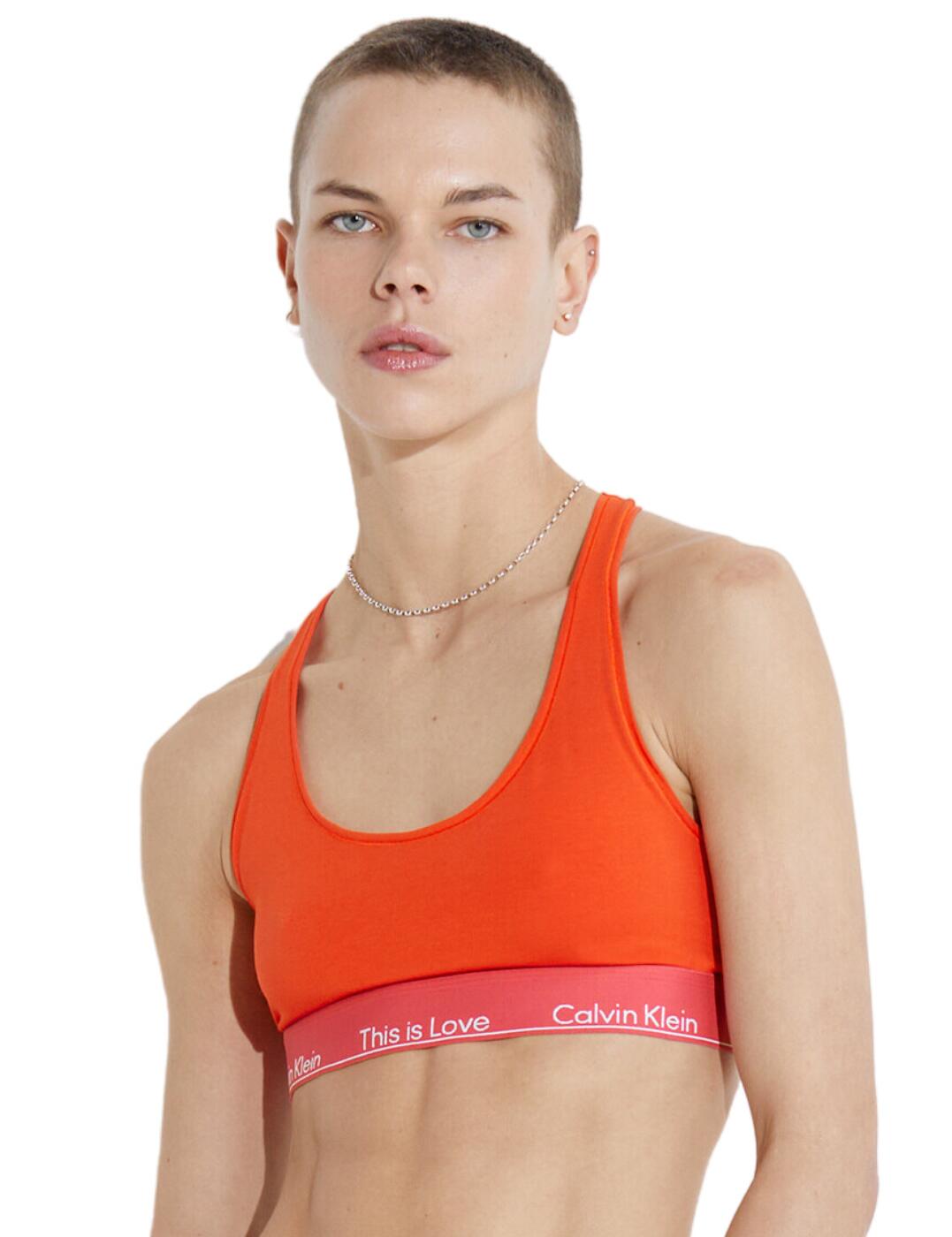 Introducing Calvin Klein's Pride unlined bralette. This stylish and comfortable lingerie item is perfect for ladies who want a little extra pop of colour in their wardrobe! The unlined and non-padded design has no wires, allowing superior comfort while the elasticated CK underband with added this is love slogan ensures a snug fit. A scoop neckline provides a sensual look, while non-adjustable racerback straps provide an easy pull-on style. For those looking to match, matching items from the Pride collection are also available.